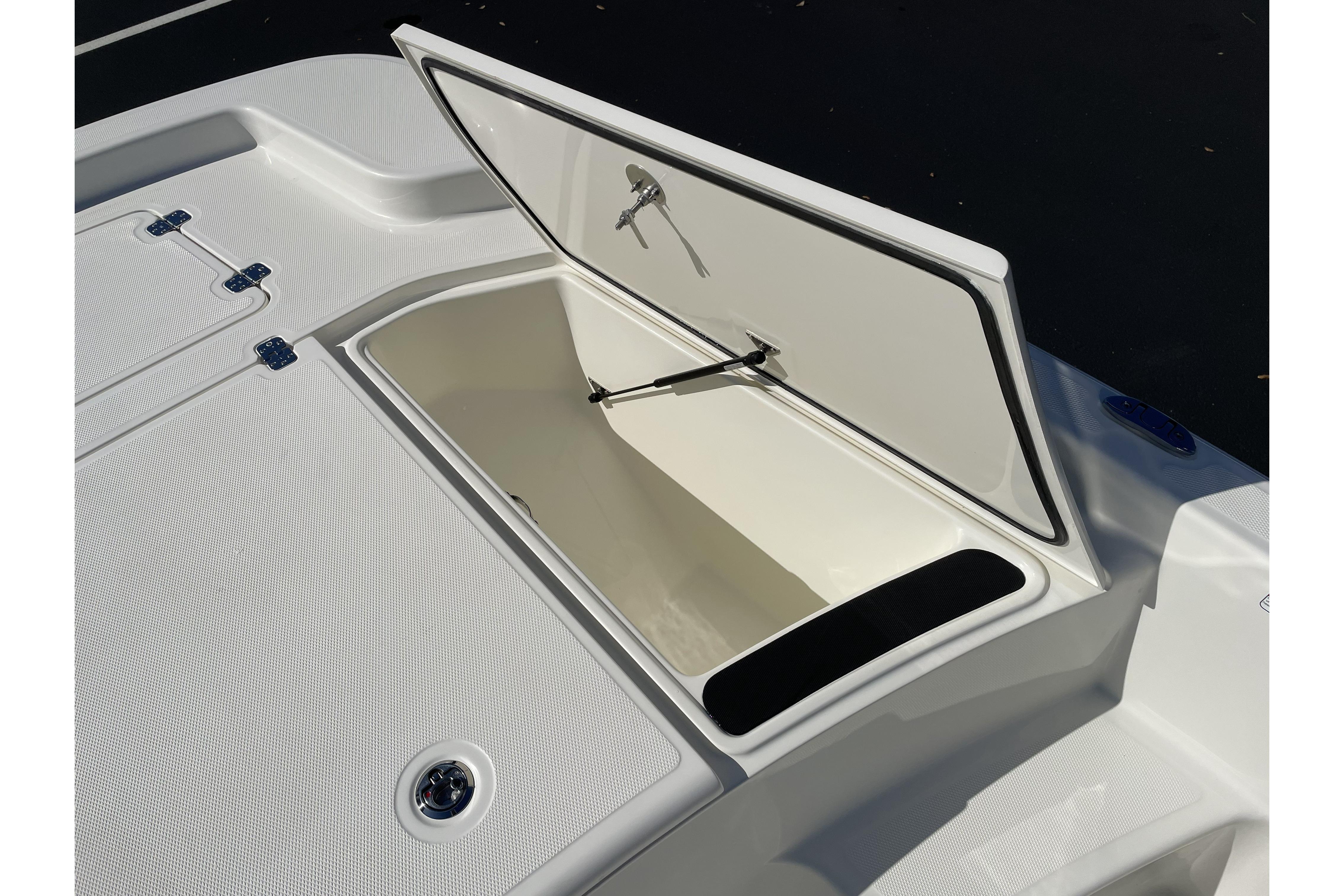 Open storage compartment on 2026 Mako Pro Skiff 19 CC boat.