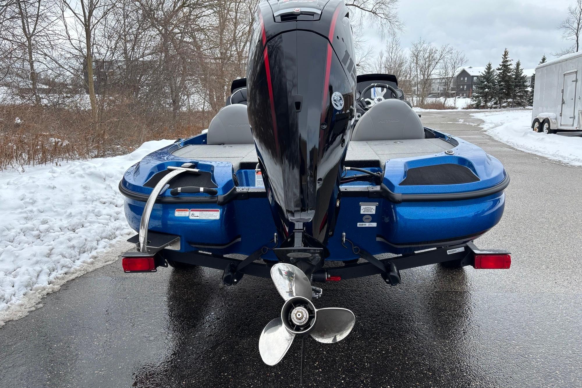 2026 Nitro Z17 boat with outboard motor on snowy road.