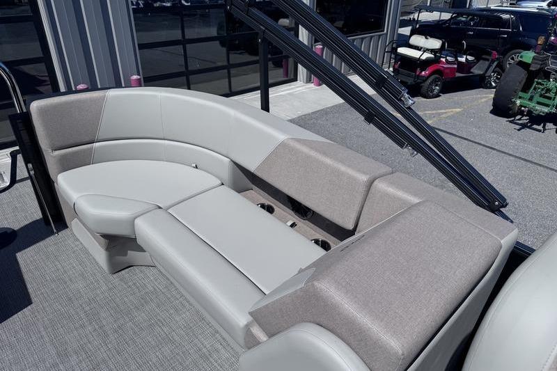 Luxurious seating on 2027 Manitou Aurora 23 RF SHP pontoon boat, featuring modern design and comfort.