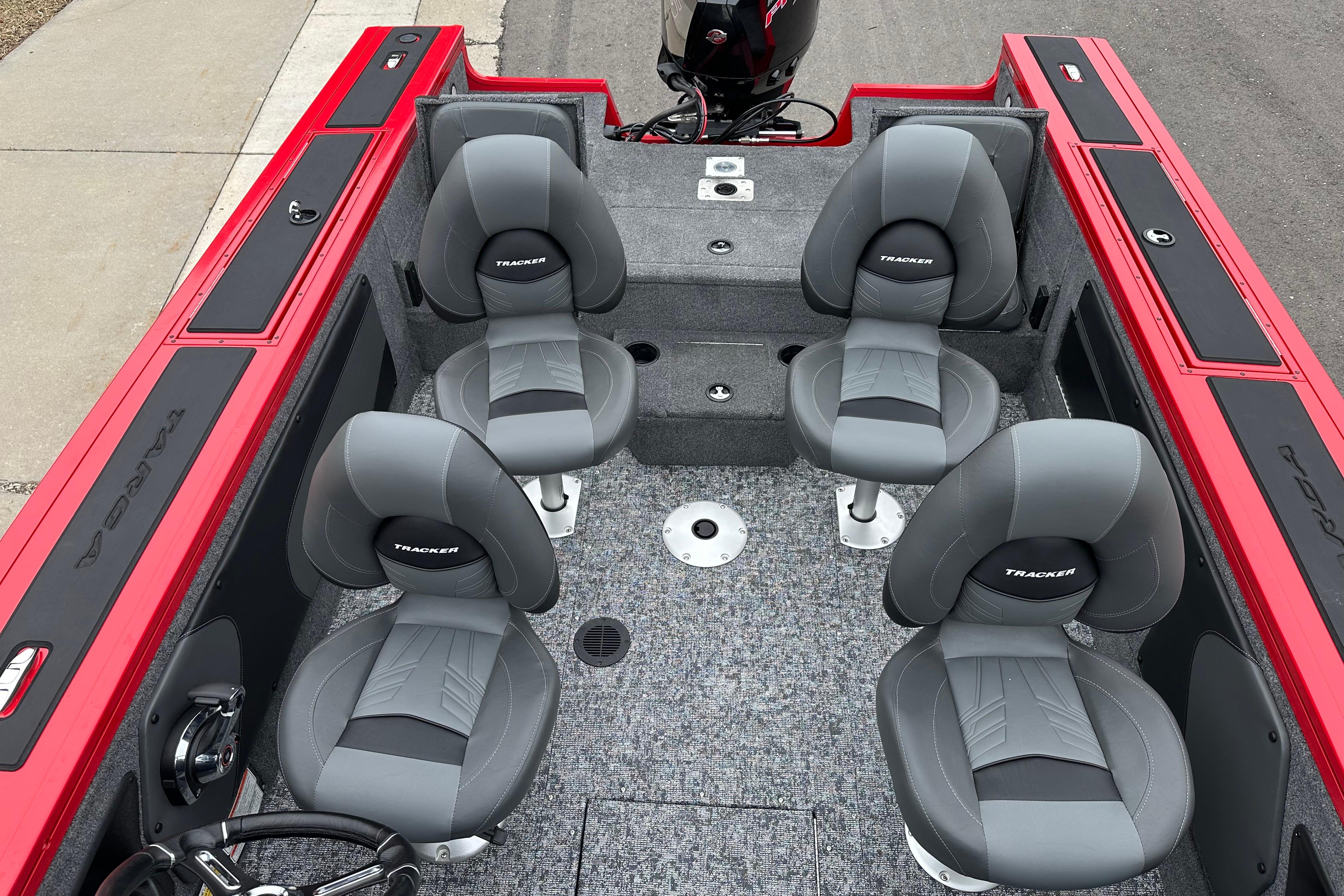 2026 Tracker Targa V-19 Combo boat interior with four gray seats and red accents.