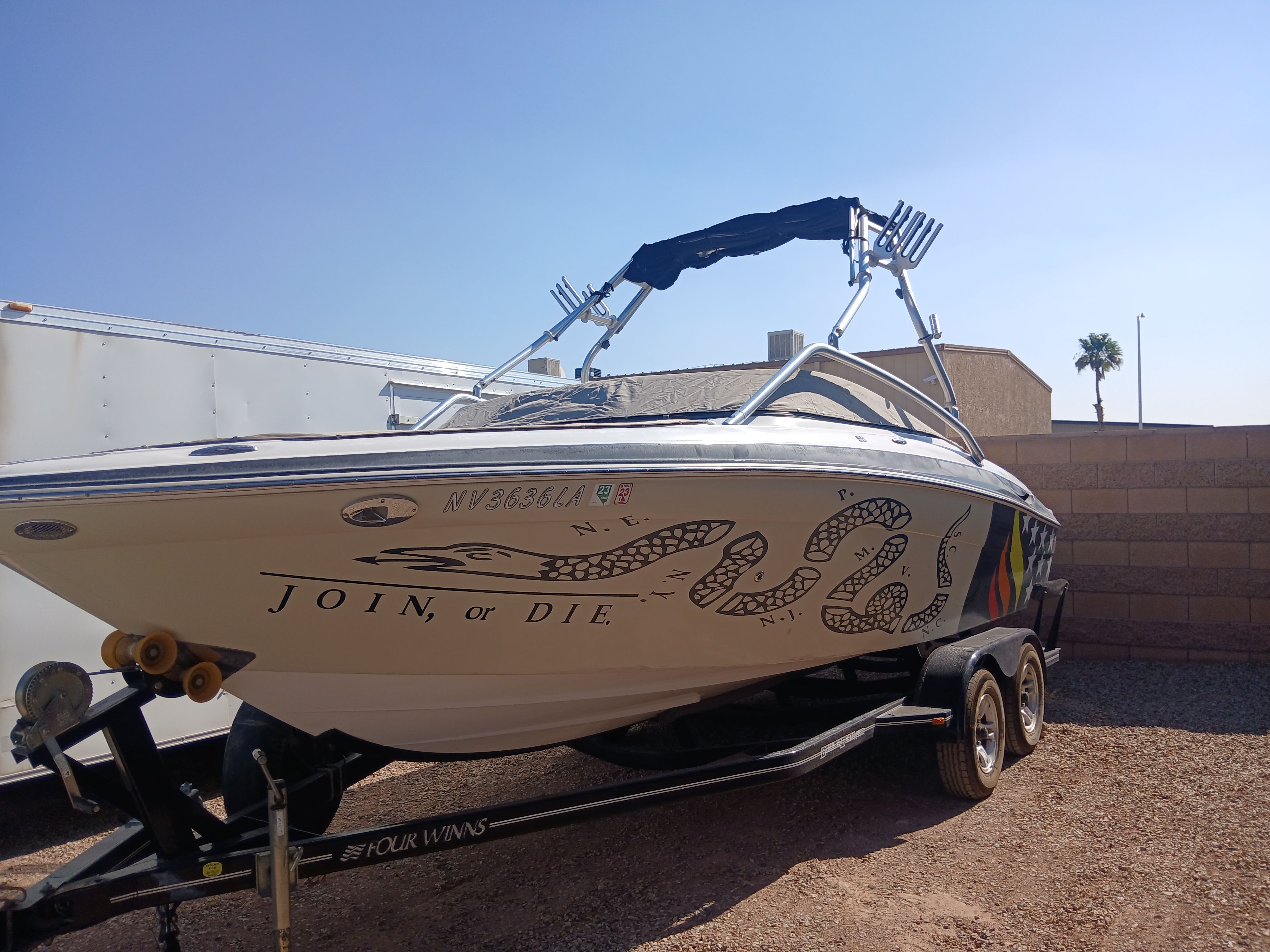 2008 Four Winns H220SS boat with "Join, or Die" design.