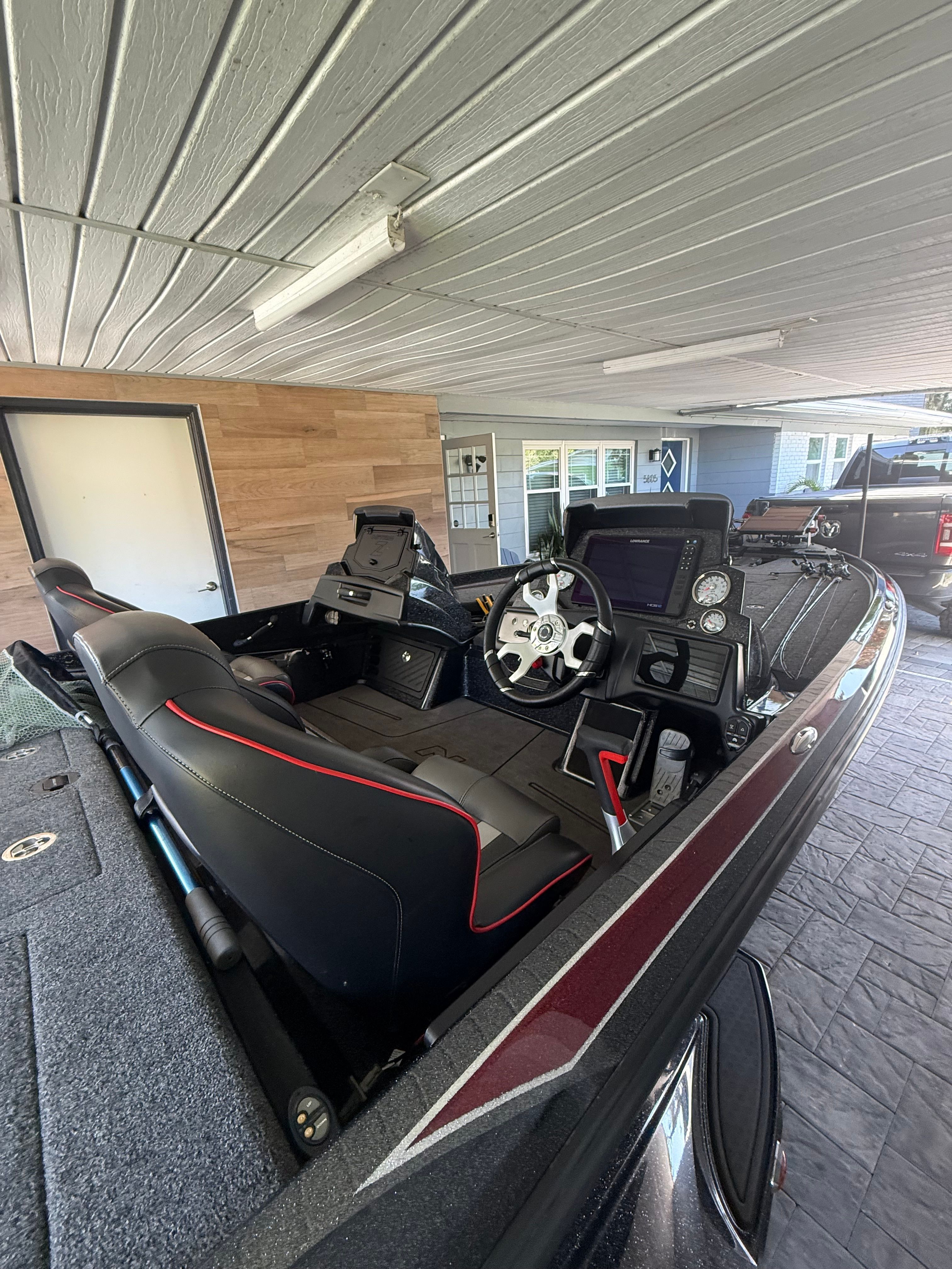 The image shows the cockpit of a 2024 Nitra Boats 21 XL Pro with modern instruments.
