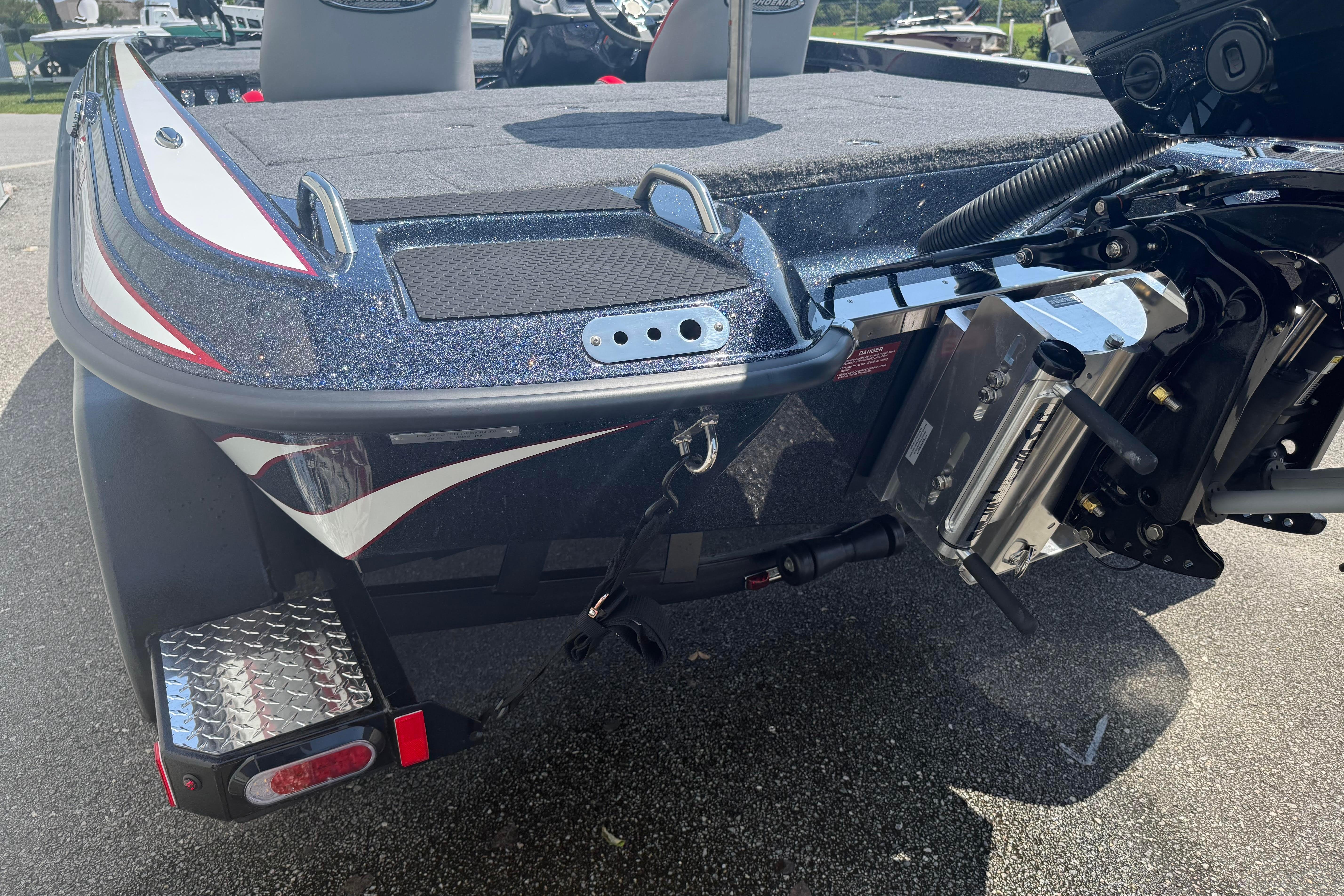 Rear view of 2027 Phoenix 819 ZXL boat, showcasing motor mount and deck details.