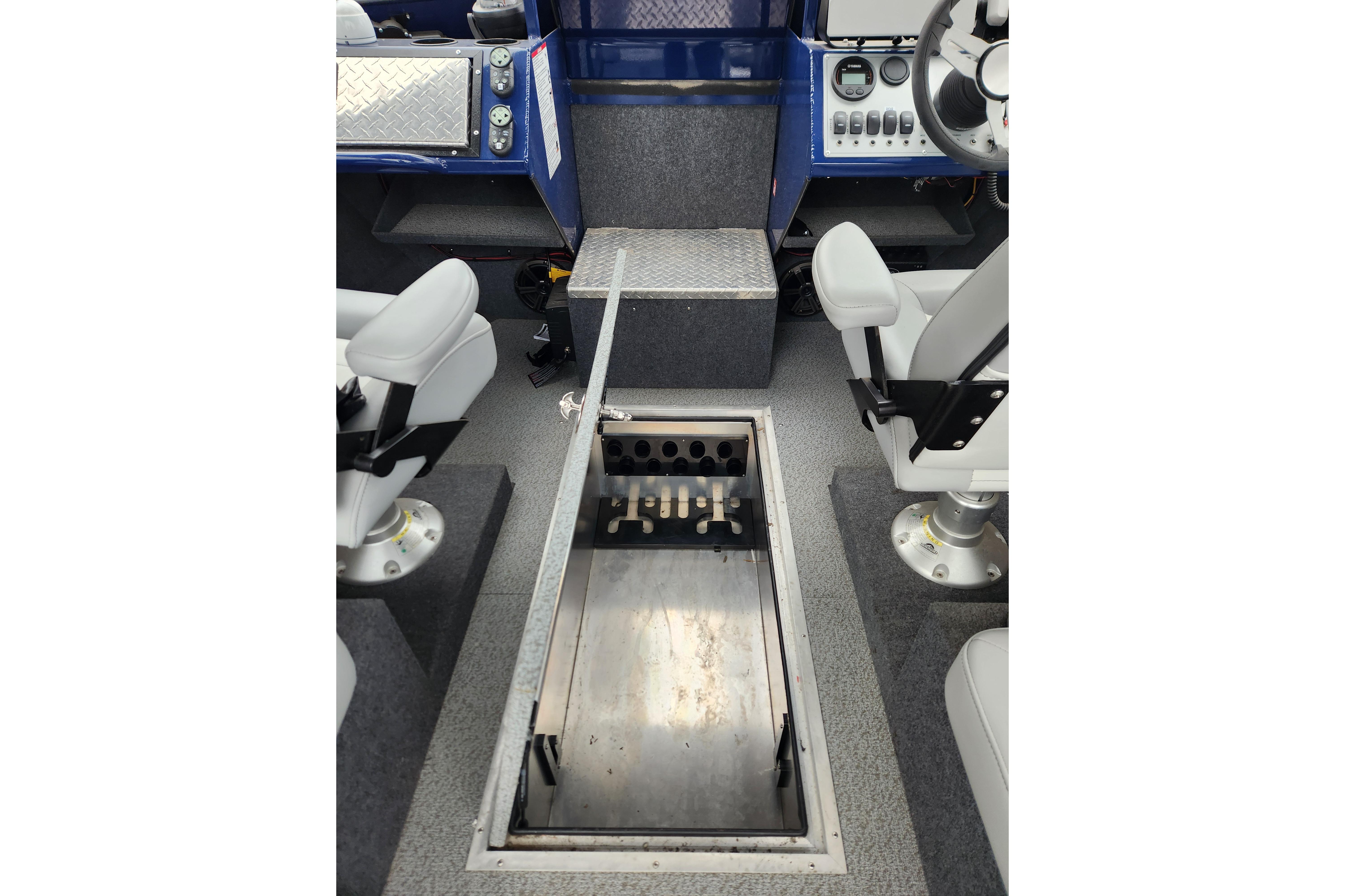Interior view of 2025 Thunder Jet 21 Chinook OS boat, featuring seating and storage compartment.