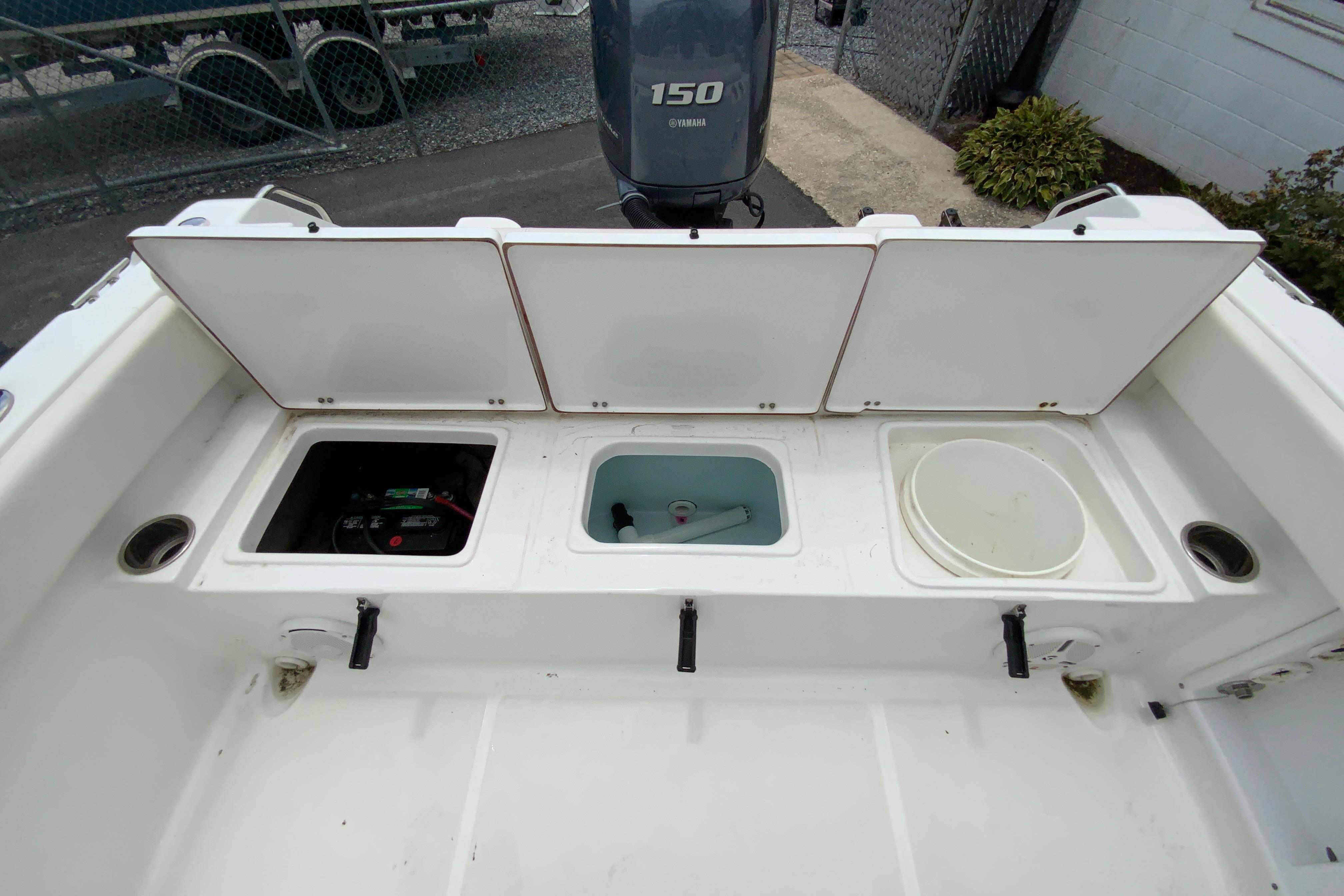 2014 Sea Hunt Escape 211 LE boat storage compartments and Yamaha 150 engine.