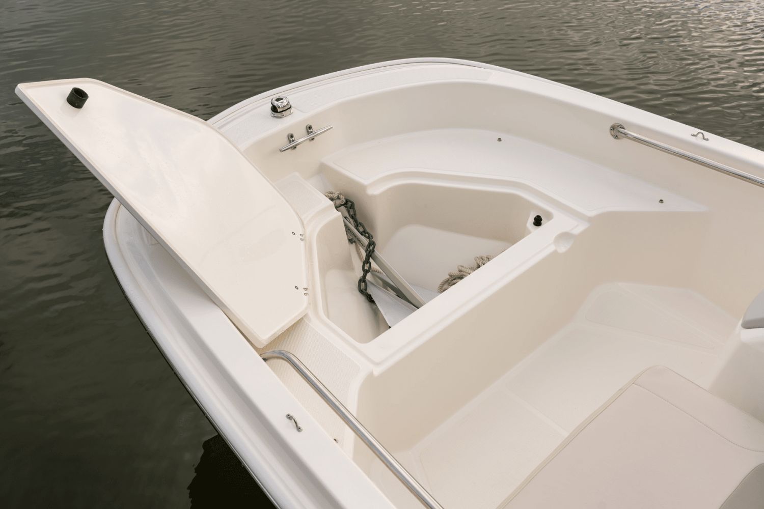 The image shows the bow of a 2026 Boston Whaler 130 Super Sport on the water.