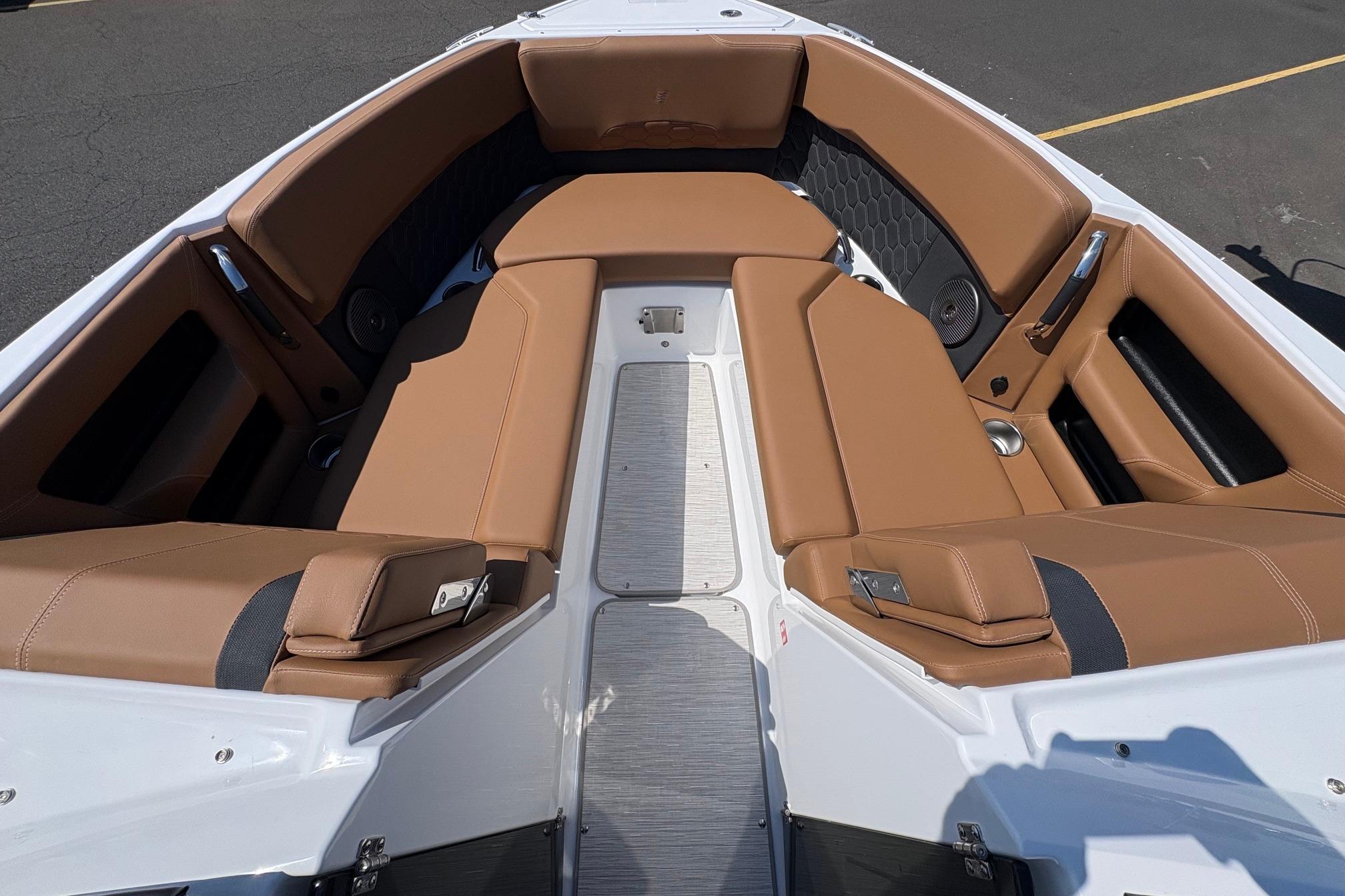Luxurious seating area of 2026 Four Winns H6 boat with tan upholstery.