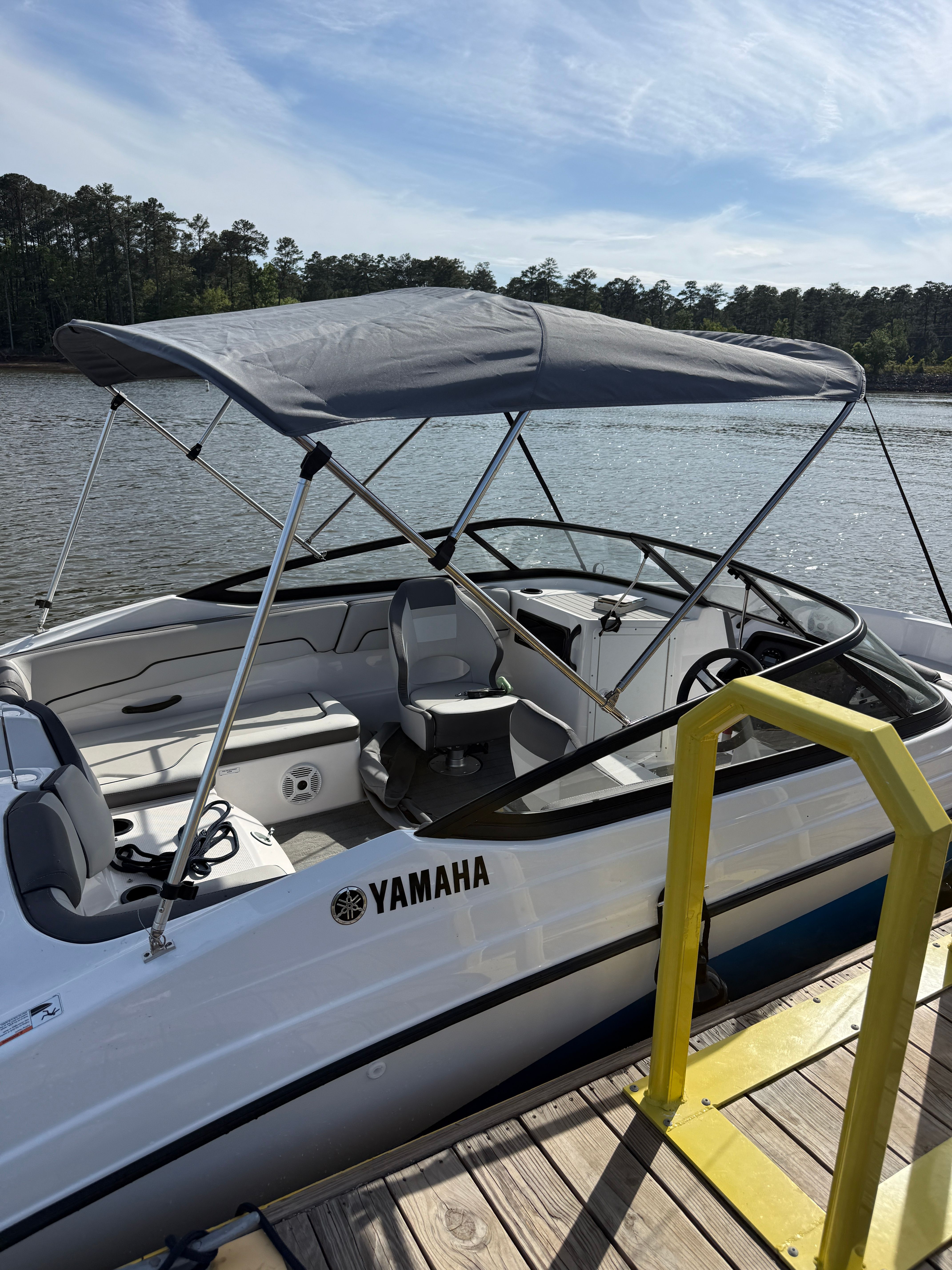 2023 Yamaha SX190 boat docked with canopy.