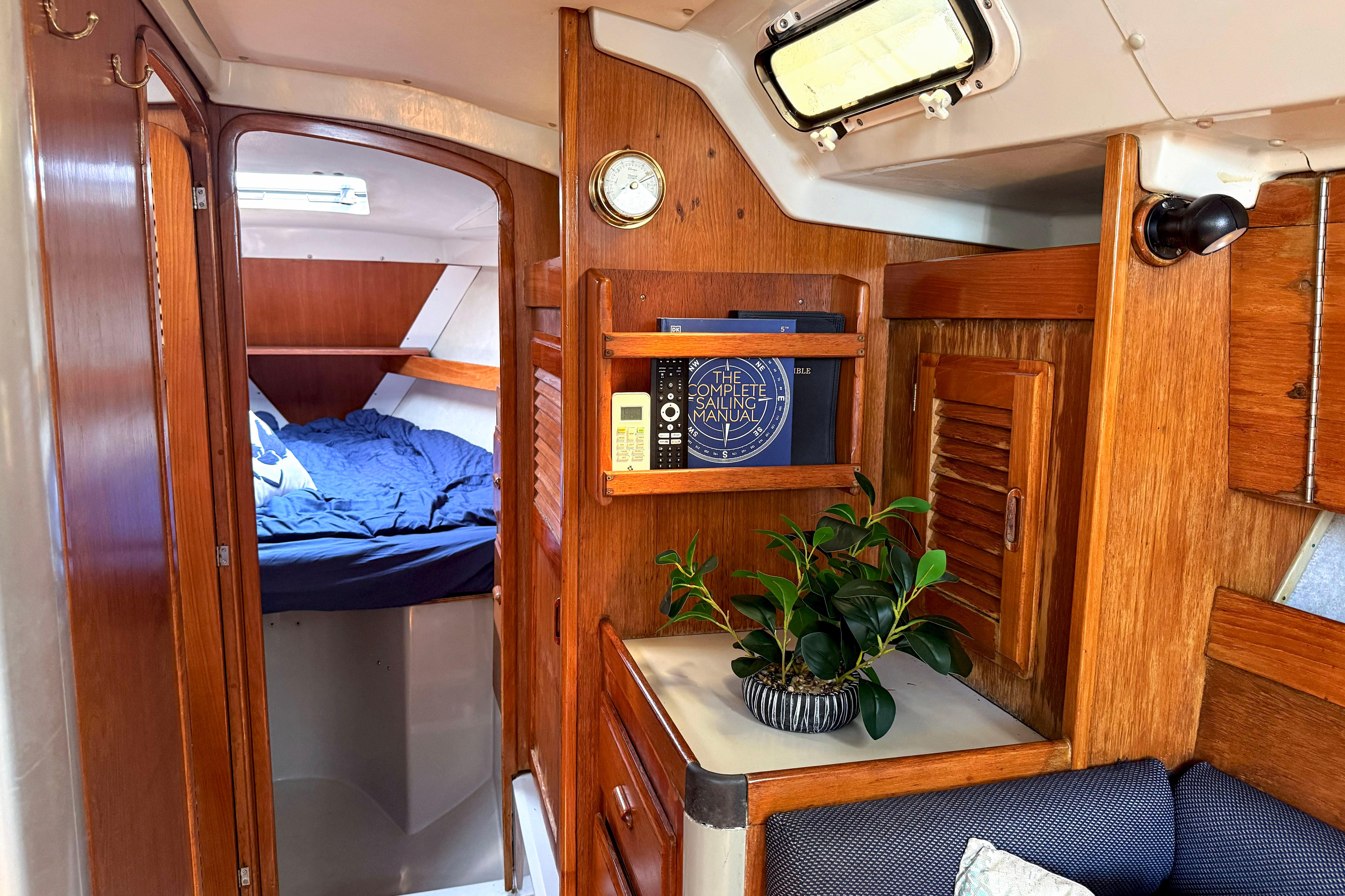 Interior of 1988 Oday 40 sailboat with cozy cabin and wooden furnishings.