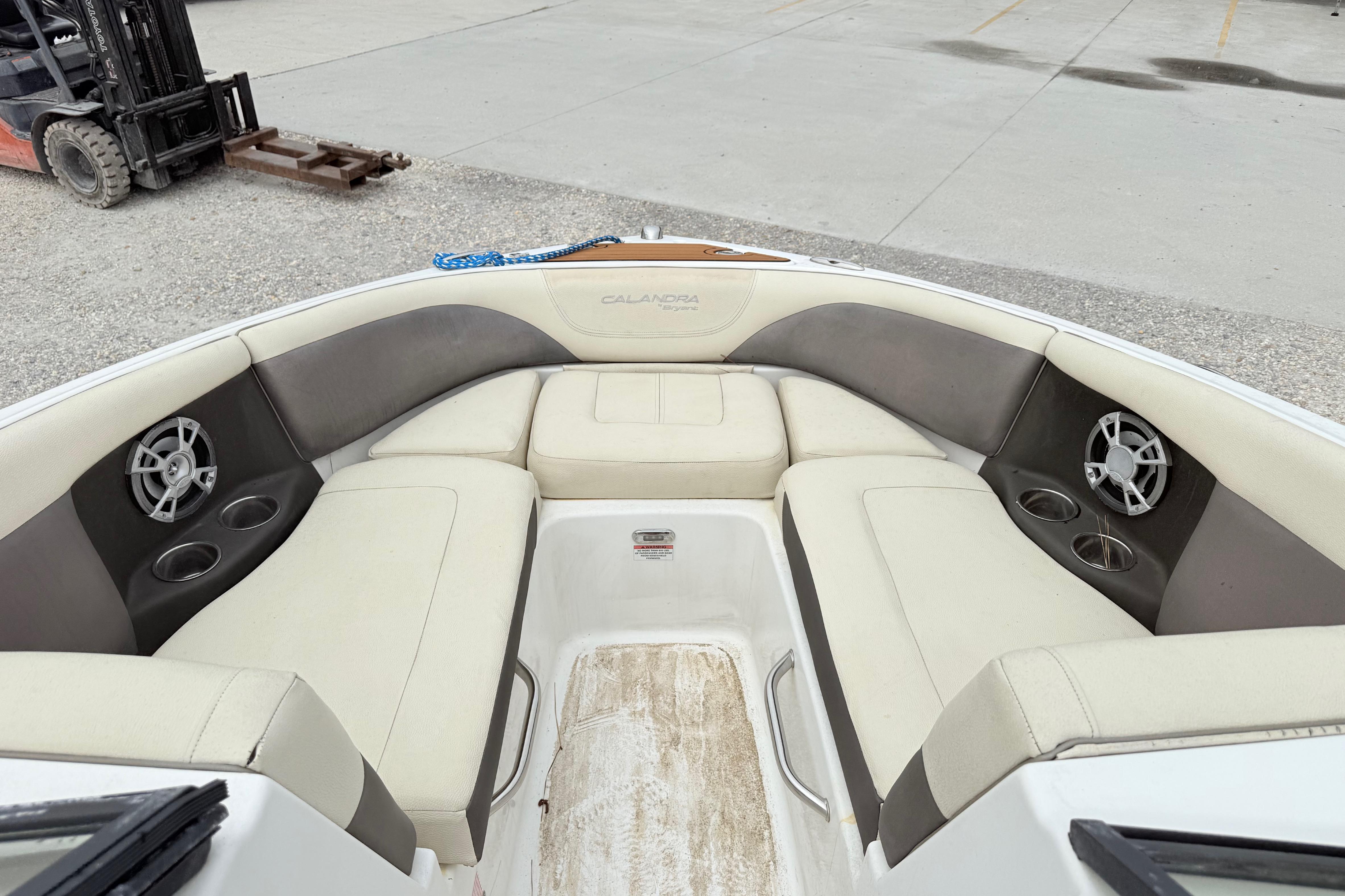 Luxurious 2018 Bryant Calandra boat interior with plush seating and built-in speakers.