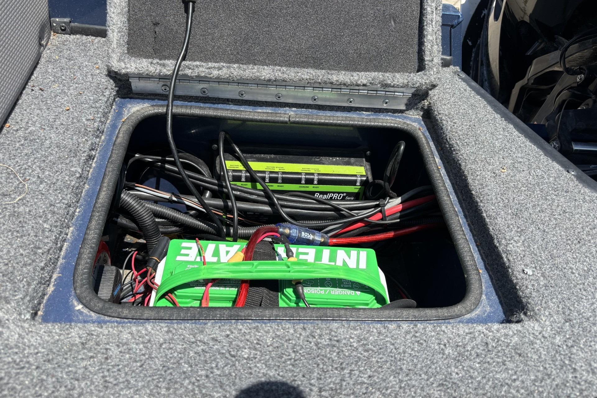 2021 Ranger VX1788 WT boat battery compartment with wiring and charger.