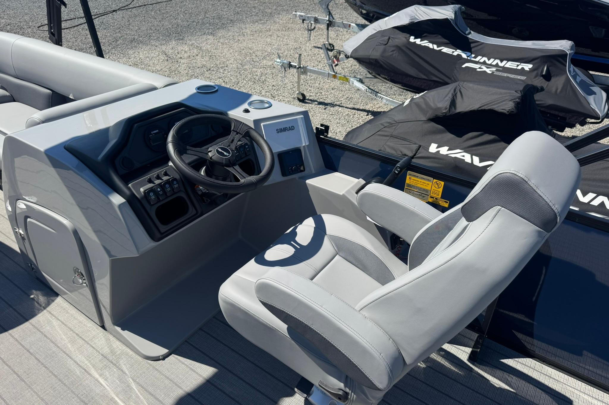2026 Bentley Pontoons Legacy 243 Swingback helm with steering wheel and controls.