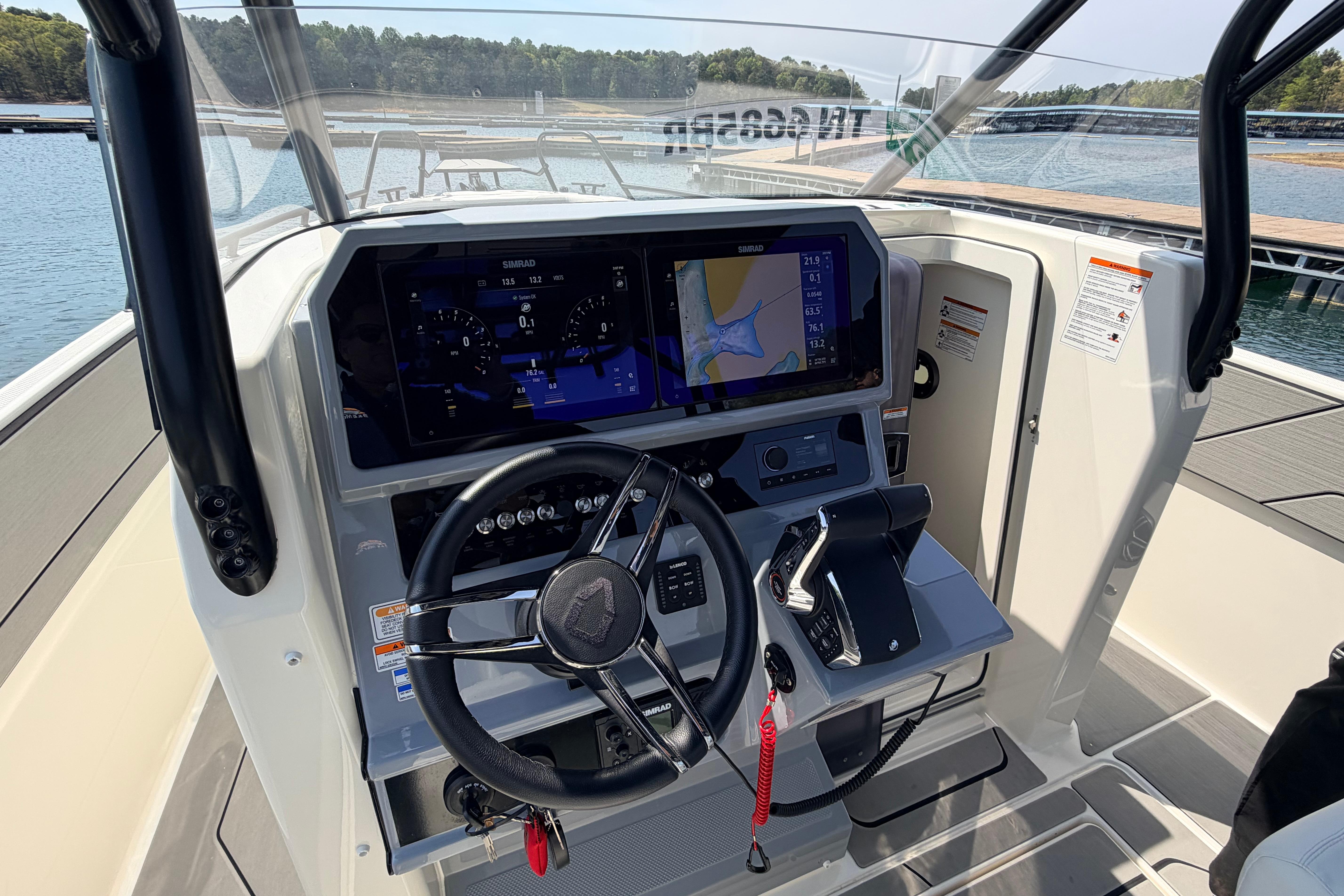 Helm of 2027 Navan T30 boat with advanced navigation system and steering wheel.
