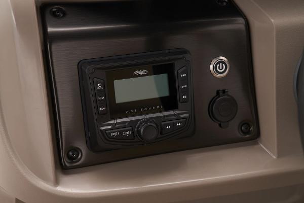 Sun Tracker SportFish 22 DLX 2024 boat dashboard with control panel and power button.