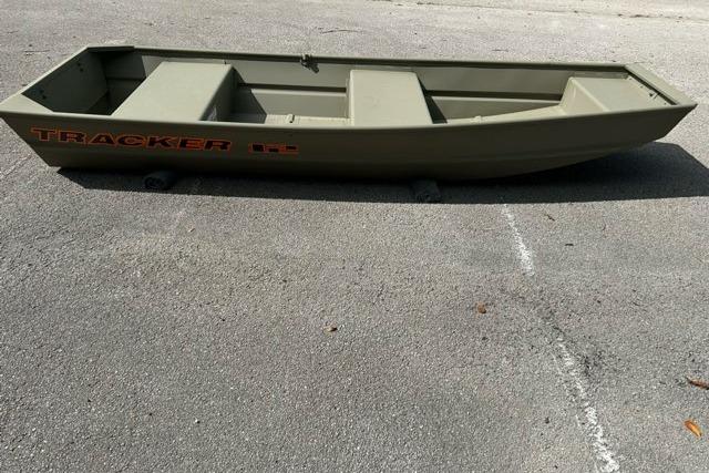 2026 Tracker Grizzly 12 Jon boat on pavement, showcasing its sturdy design.