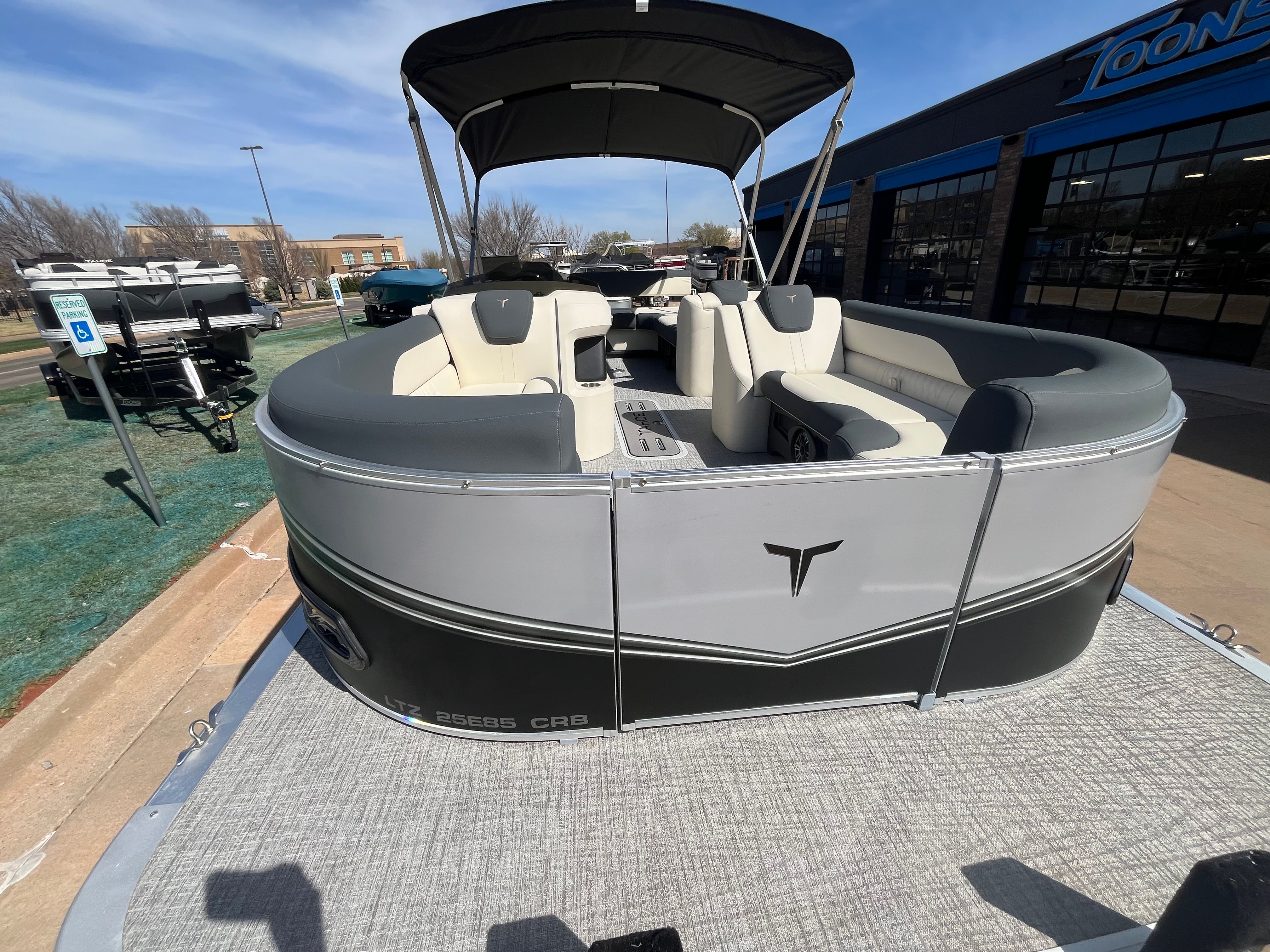 2026 Tahoe 2385 LTZ Cruise pontoon boat with rear bench, displayed outdoors.