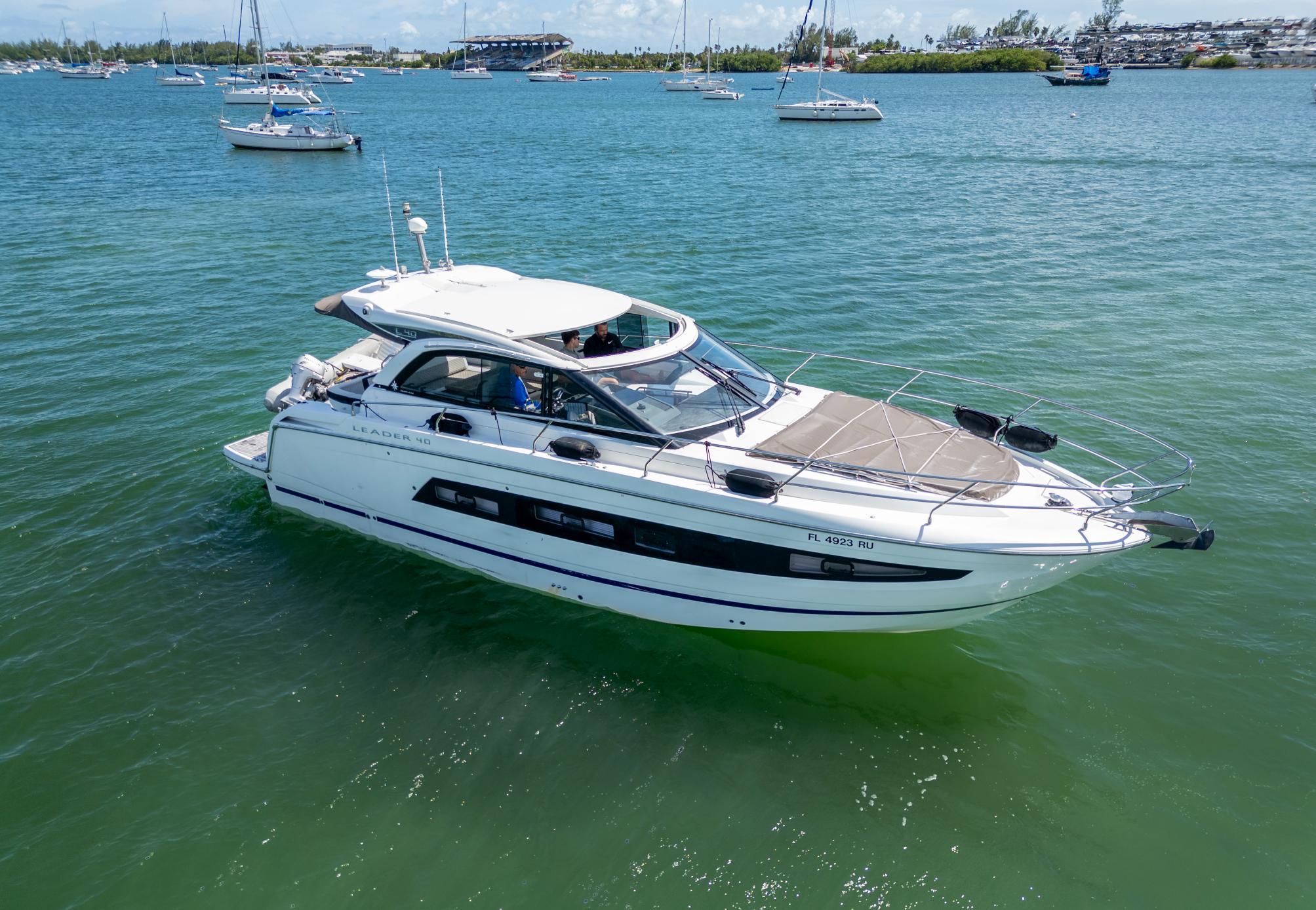 2019 Jeanneau Leader 40 yacht cruising on a sunny day in a scenic bay.