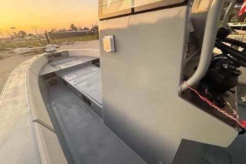 2019 Metal Shark 28 CC boat deck at sunset, showcasing sleek design and modern features.