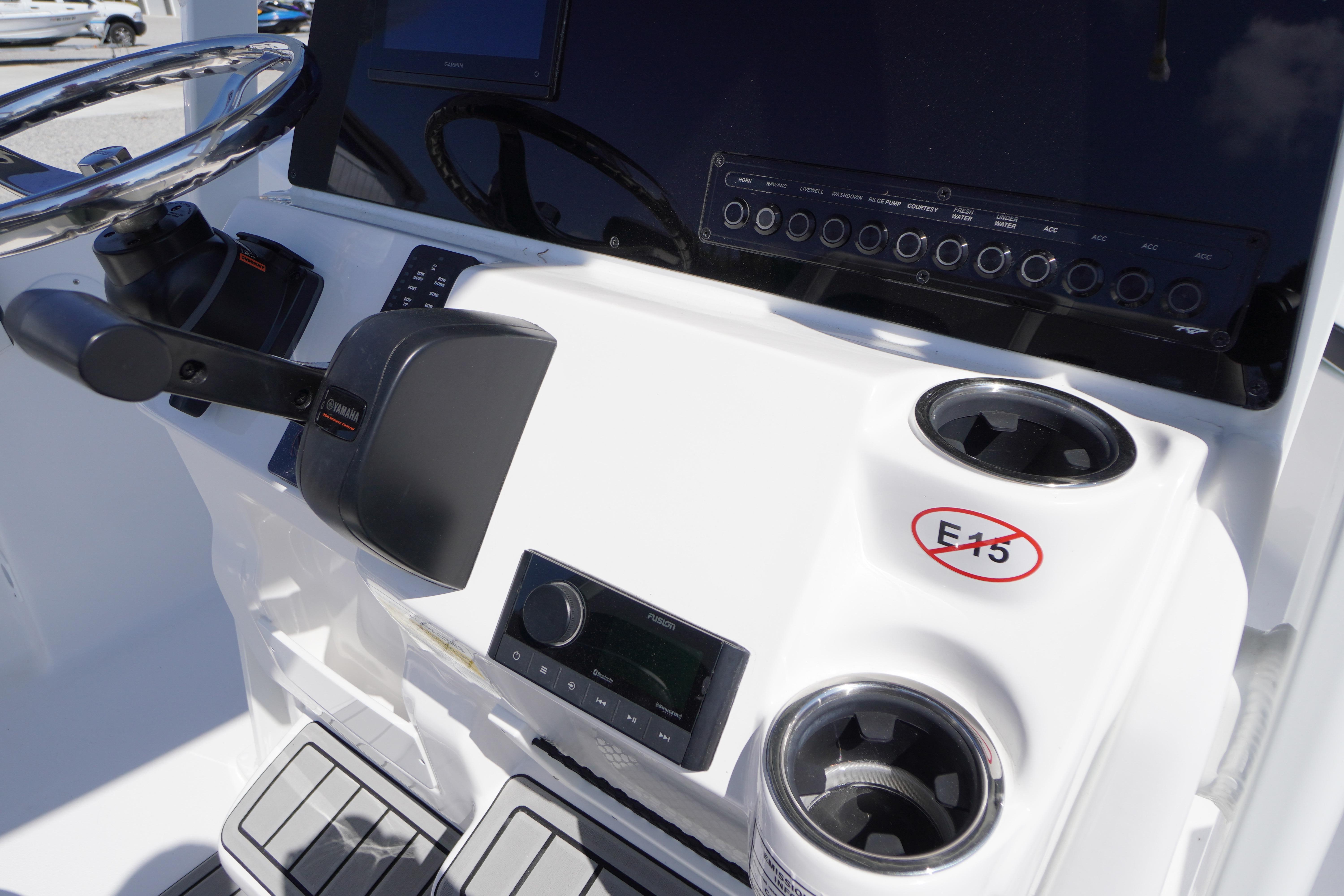2026 Tidewater 220 CC Adventure boat dashboard with steering wheel and control panel.