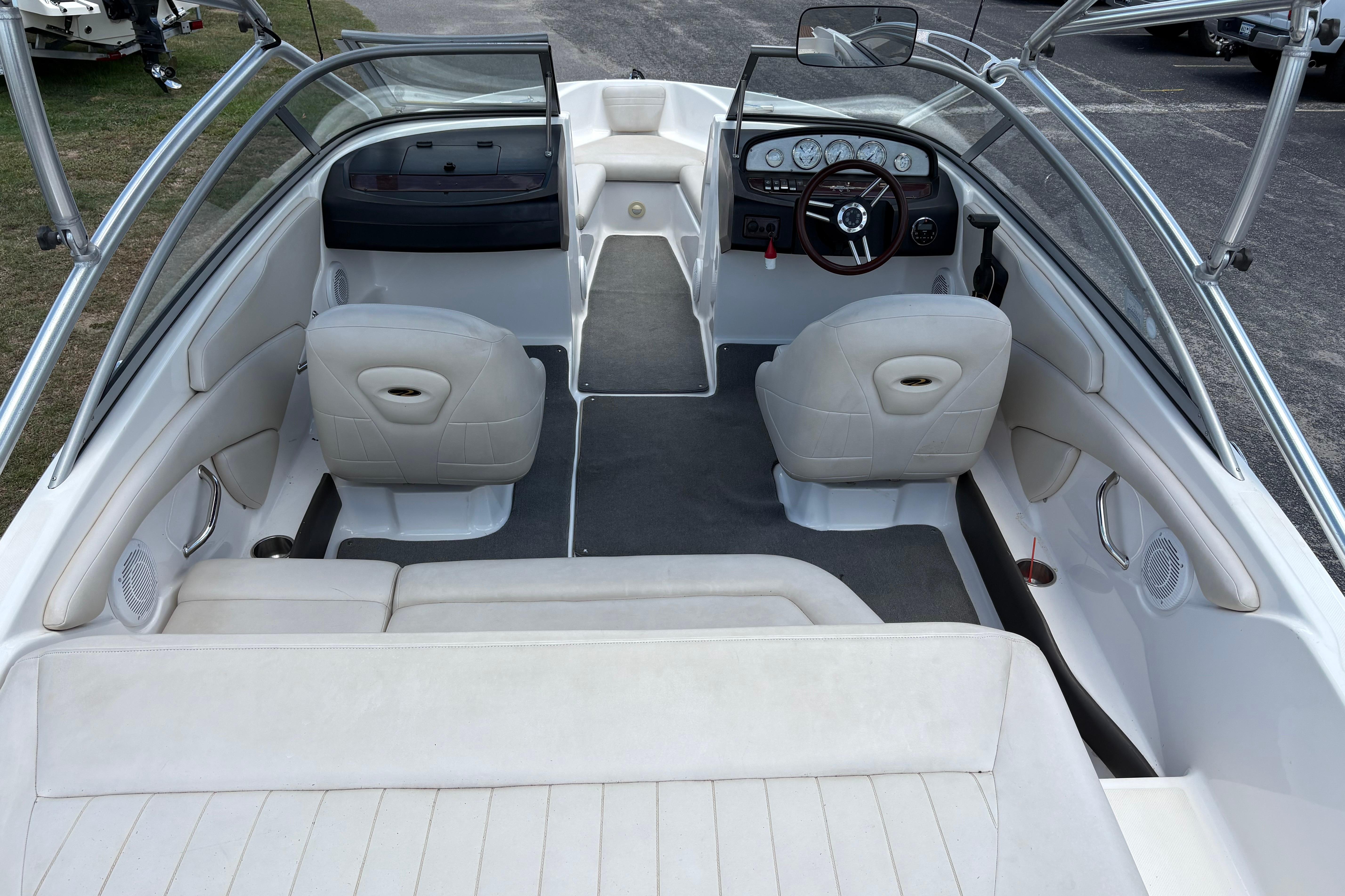 2008 Regal 1900 Bowrider interior with seating and steering wheel, showcasing sleek design.