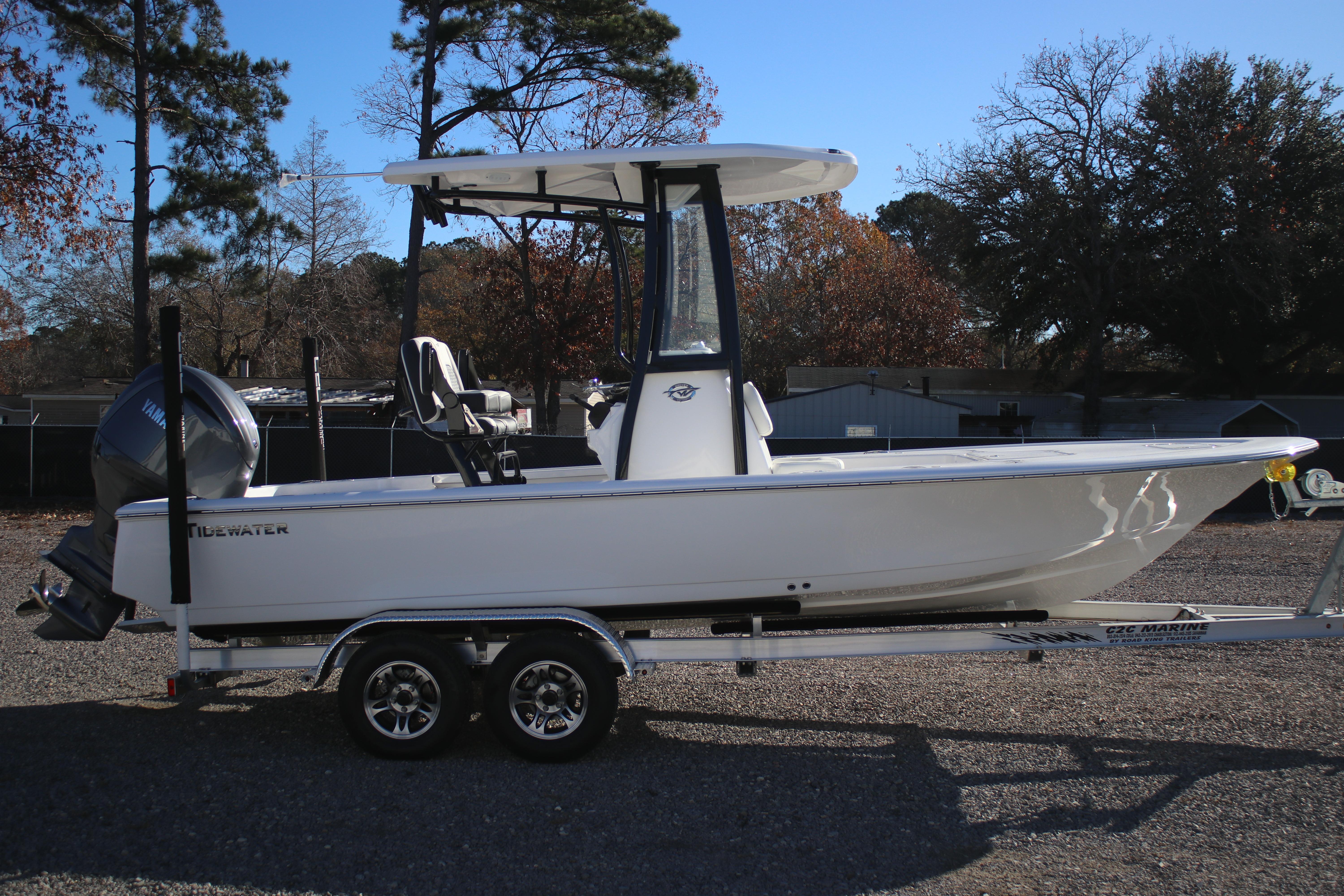 2026 Tidewater 2210 Carolina Bay boat on trailer, parked outdoors.