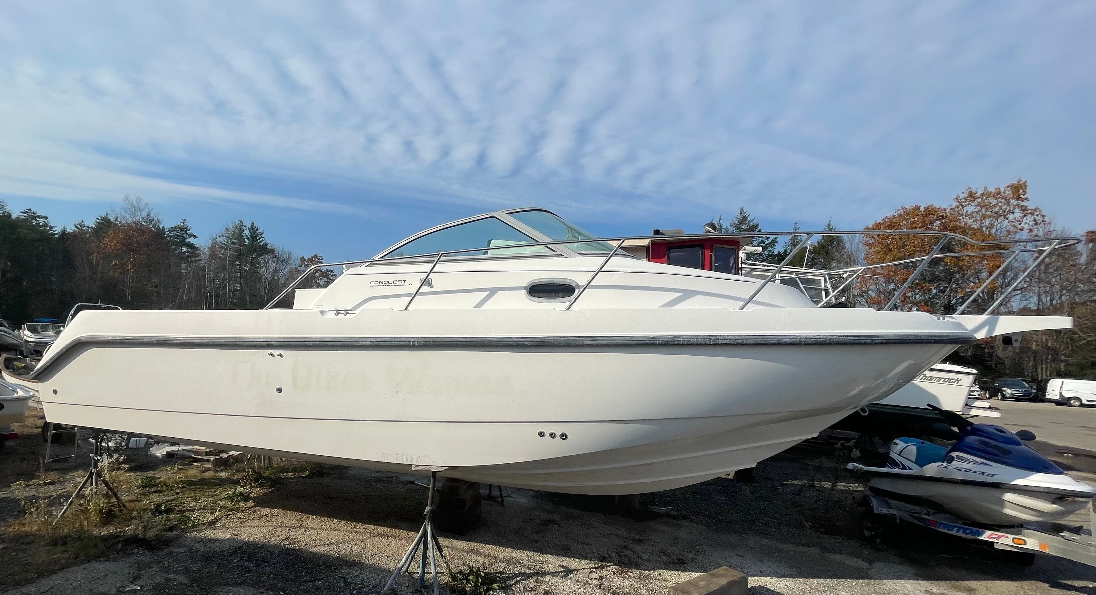 2001 Boston Whaler 26 Conquest on a boat storage lot.