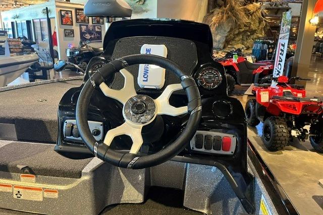 Steering wheel of a 2026 Nitro Z17 boat in showroom setting.