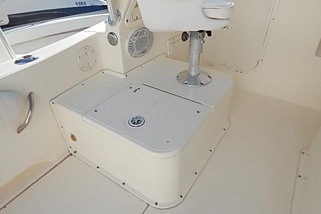 2003 World Cat 270 EC boat interior, featuring seating and storage area.
