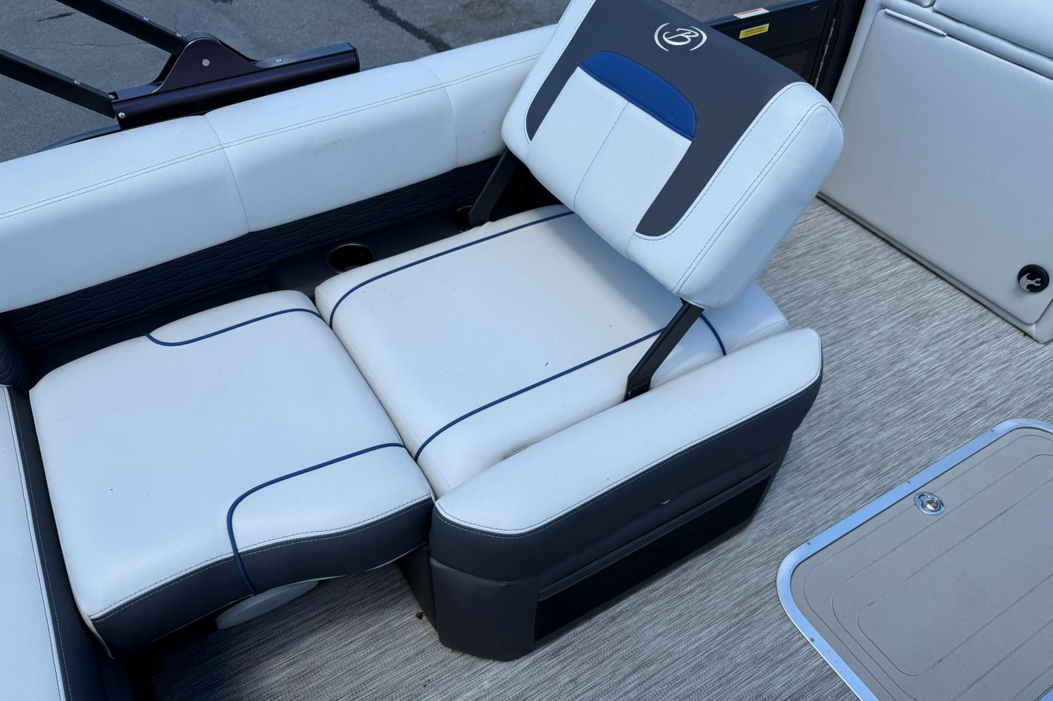 2023 Barletta Corsa 23U boat interior with white and blue seating.