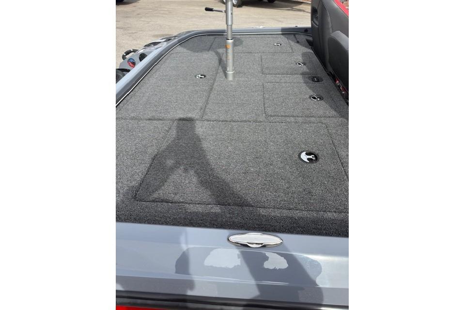 2026 Nitro Z21 XL boat deck with storage compartments and carpeted surface.