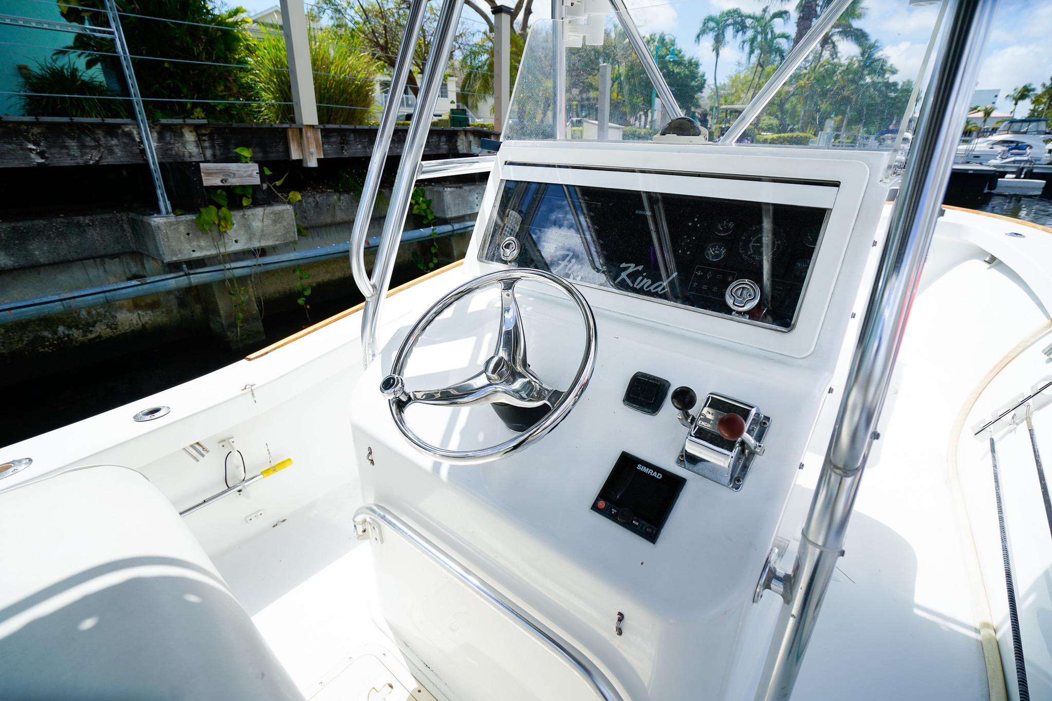 1977 Scarborough 27 CC boat helm with steering wheel and control panel.
