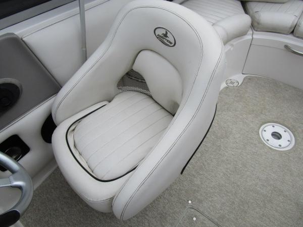 2004 Ebbtide 22 Mystique boat interior with plush white seating.
