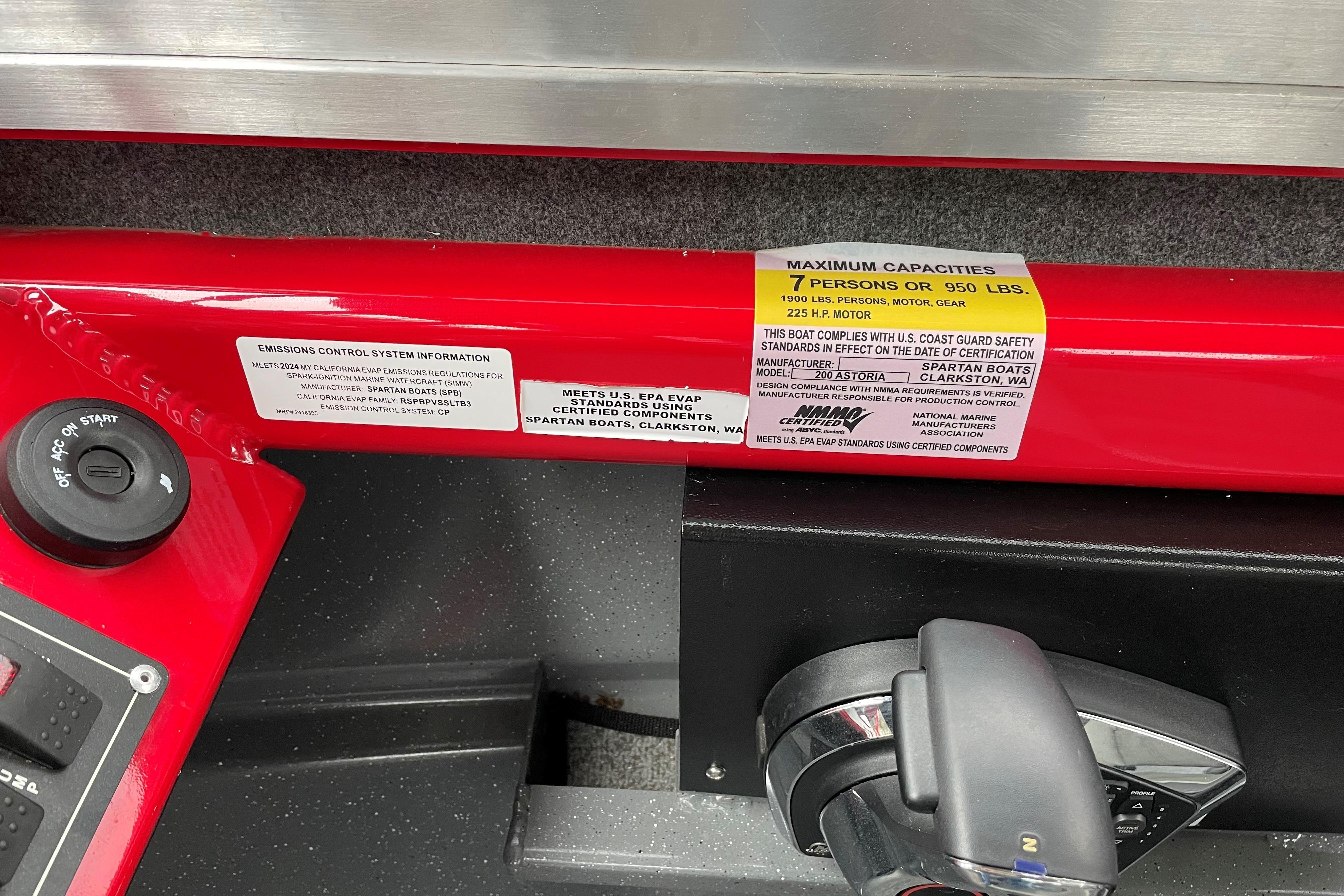 2024 Spartan 200 Astoria boat capacity label, showing 7-person or 950 lbs limit.