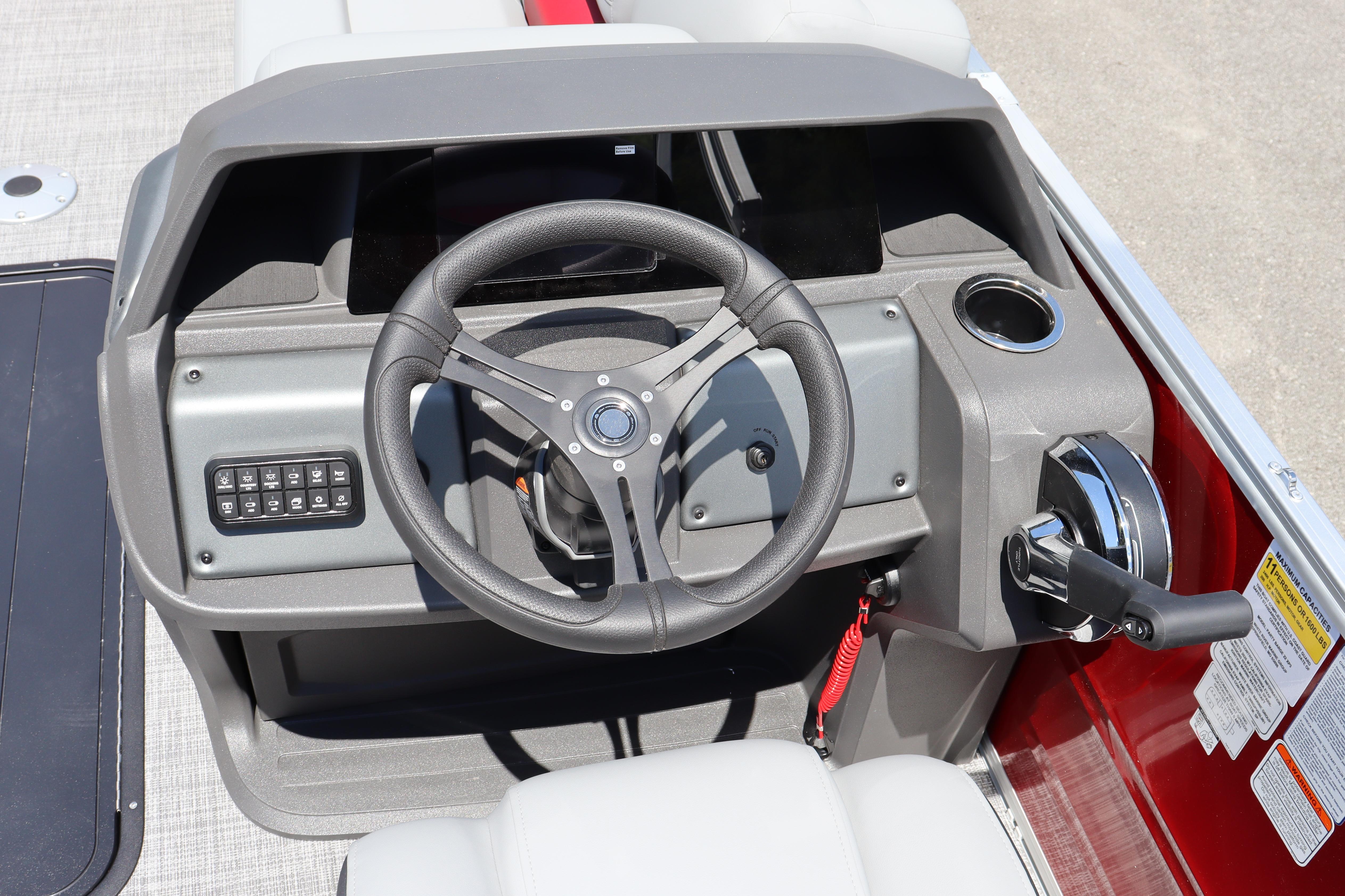 Steering console of 2026 Sun Tracker Party Barge 22 XP3 pontoon boat.