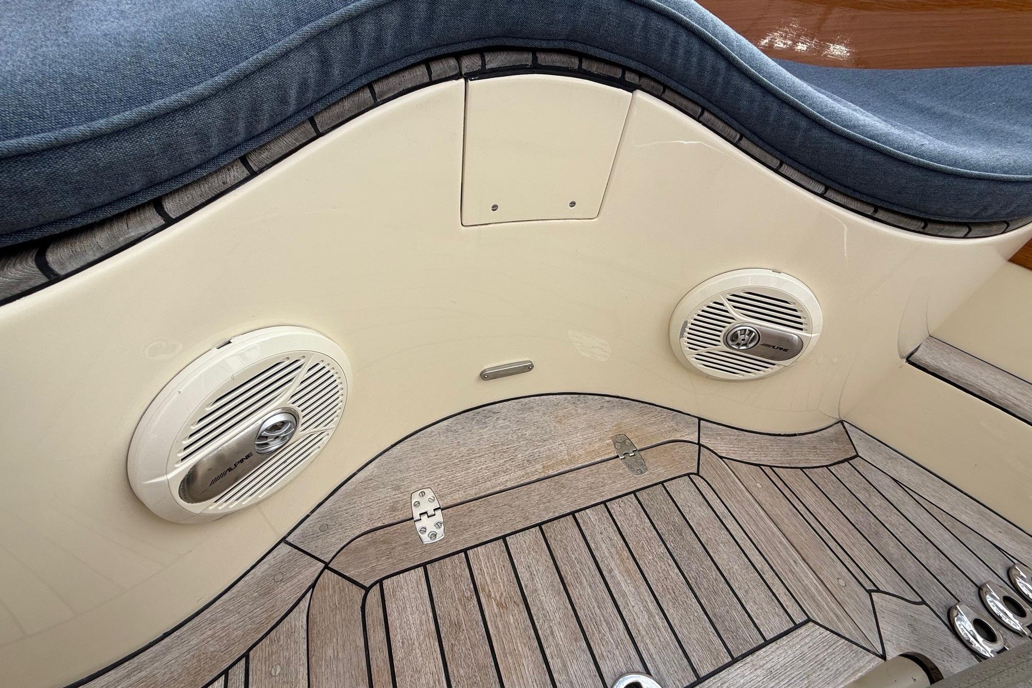 Hinckley DS 42 (2015) boat interior with speakers and wooden flooring.