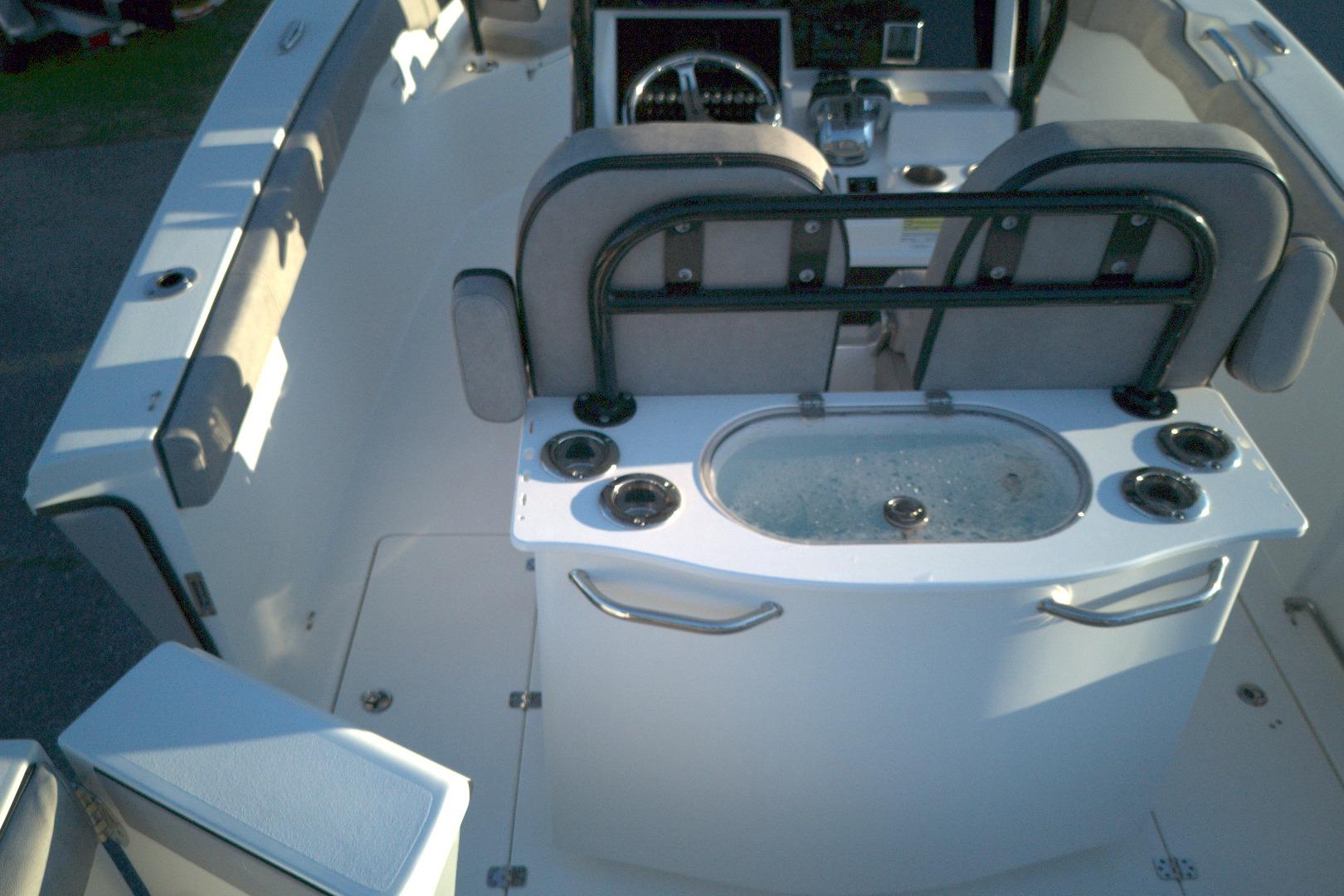 2021 Sea Pro 259 Center Console boat interior with seating and control panel.