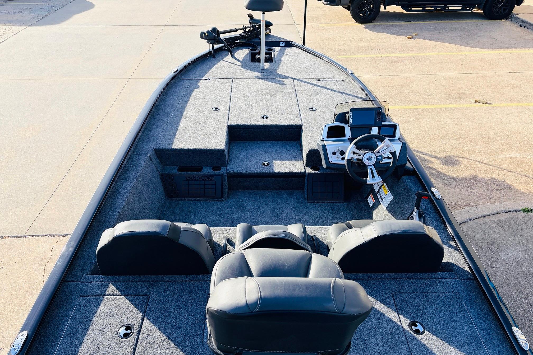 2025 Tracker Savage 215 boat interior with steering wheel and seating arrangement.