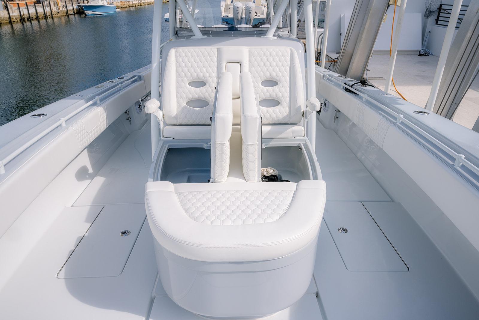 2024 Contender 44 ST boat interior with white seating and sleek design.