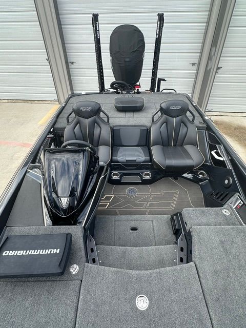 The image shows the interior of a 2023 Skeeter FXR21 Apex boat with gray seating.