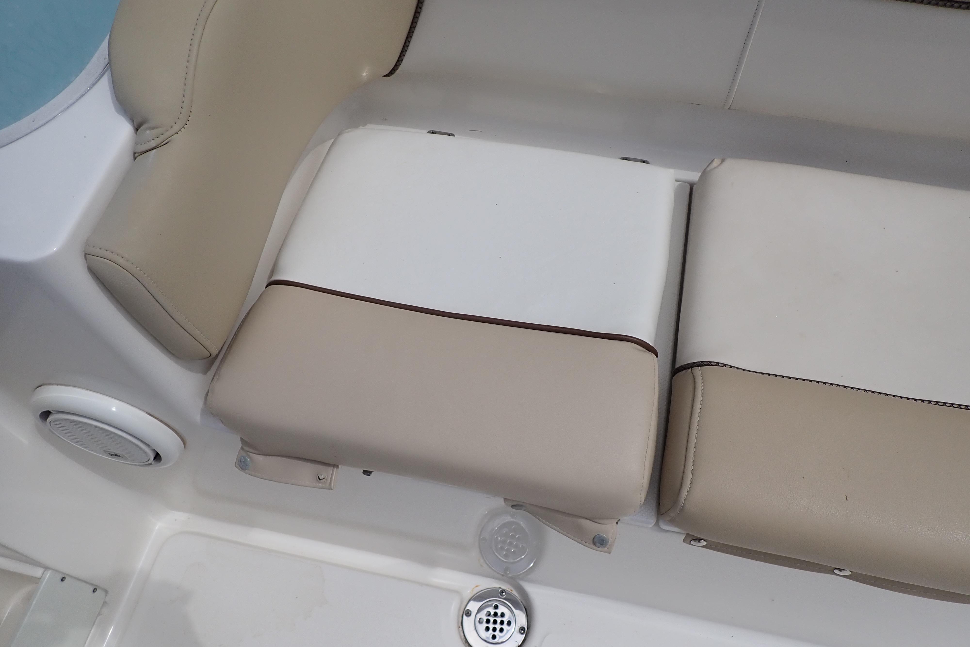 Beige and white seating on a 2019 Key West 263 FS boat interior.