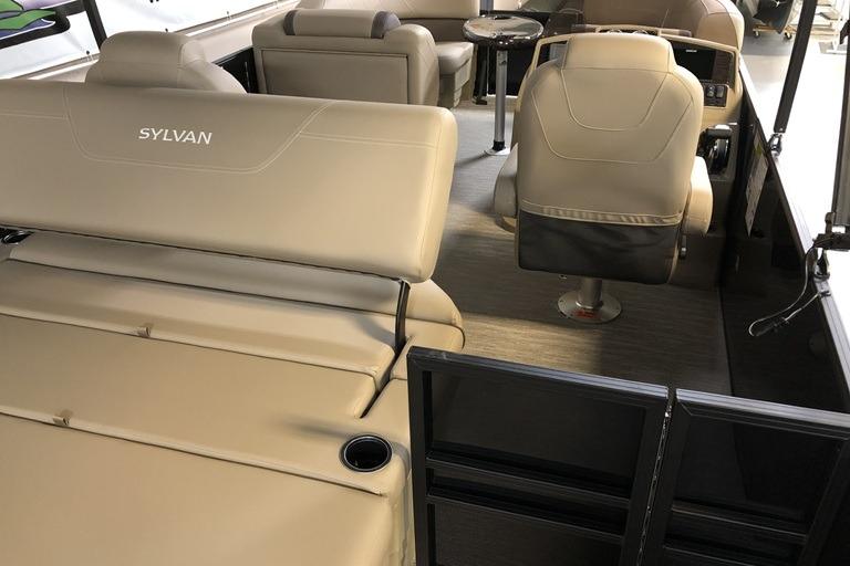 2027 Sylvan Mirage 820 CLZ DH pontoon boat interior with beige seating and helm.