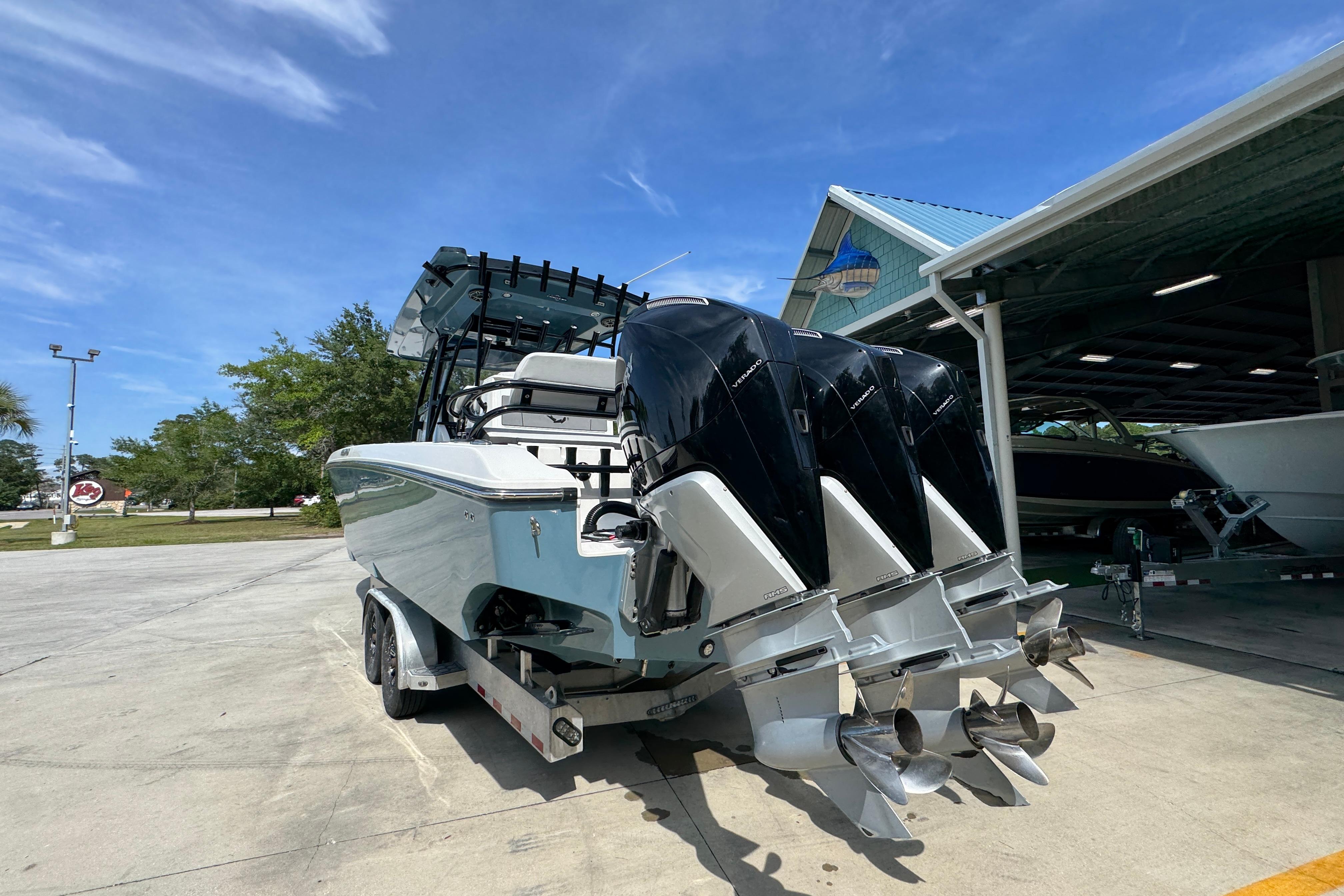 2023 Fountain 34 Tournament Edition boat with triple outboard engines on a trailer.