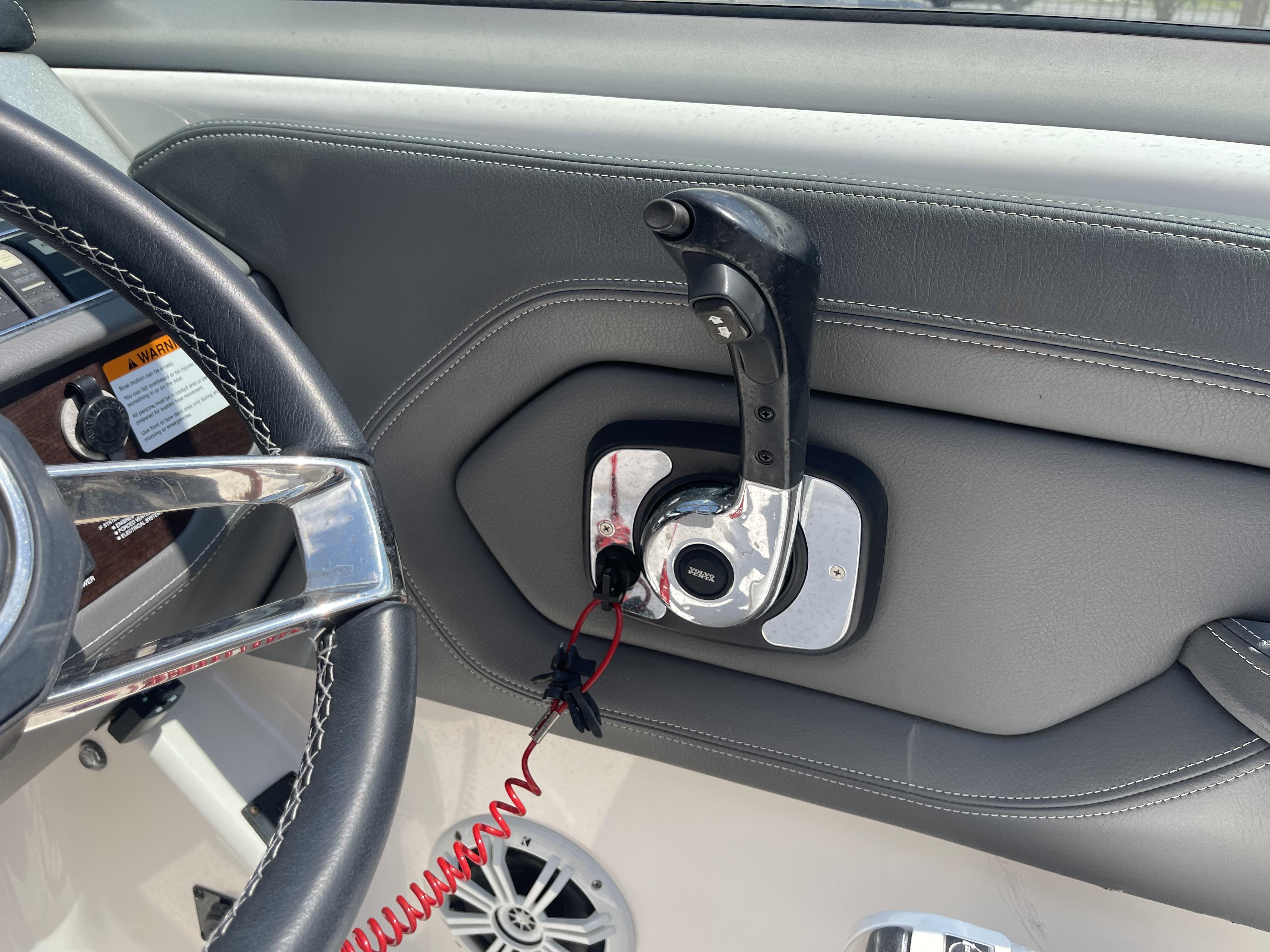 2014 Chaparral Sunesta 224 boat steering wheel and throttle control detail.