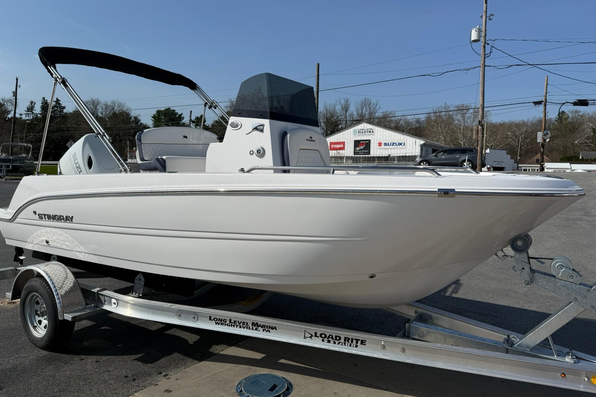 2026 Stingray 173 CC boat on trailer, displayed outdoors at a marina.