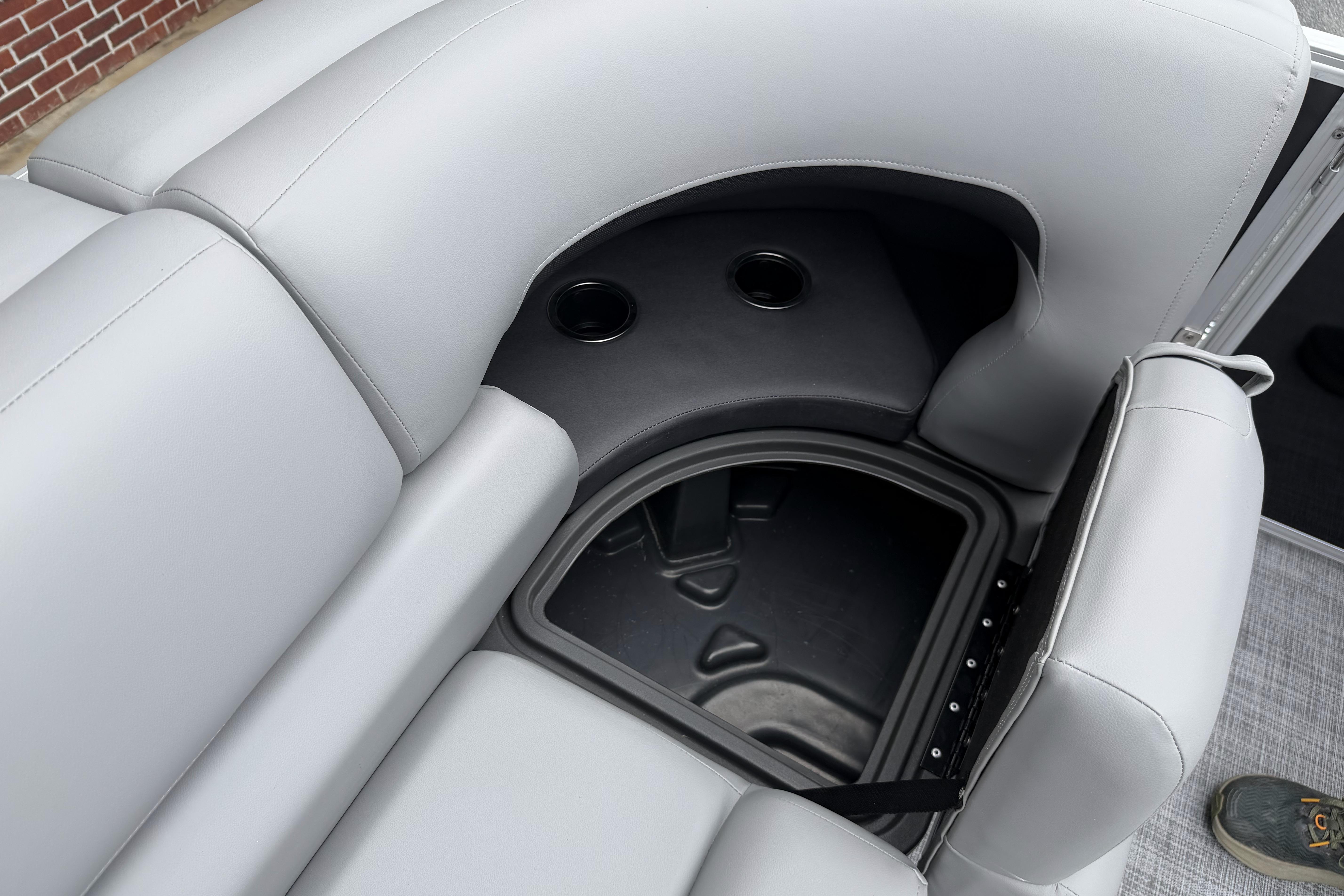 Interior seating and storage of 2026 Sun Tracker Party Barge 20 DLX pontoon boat.