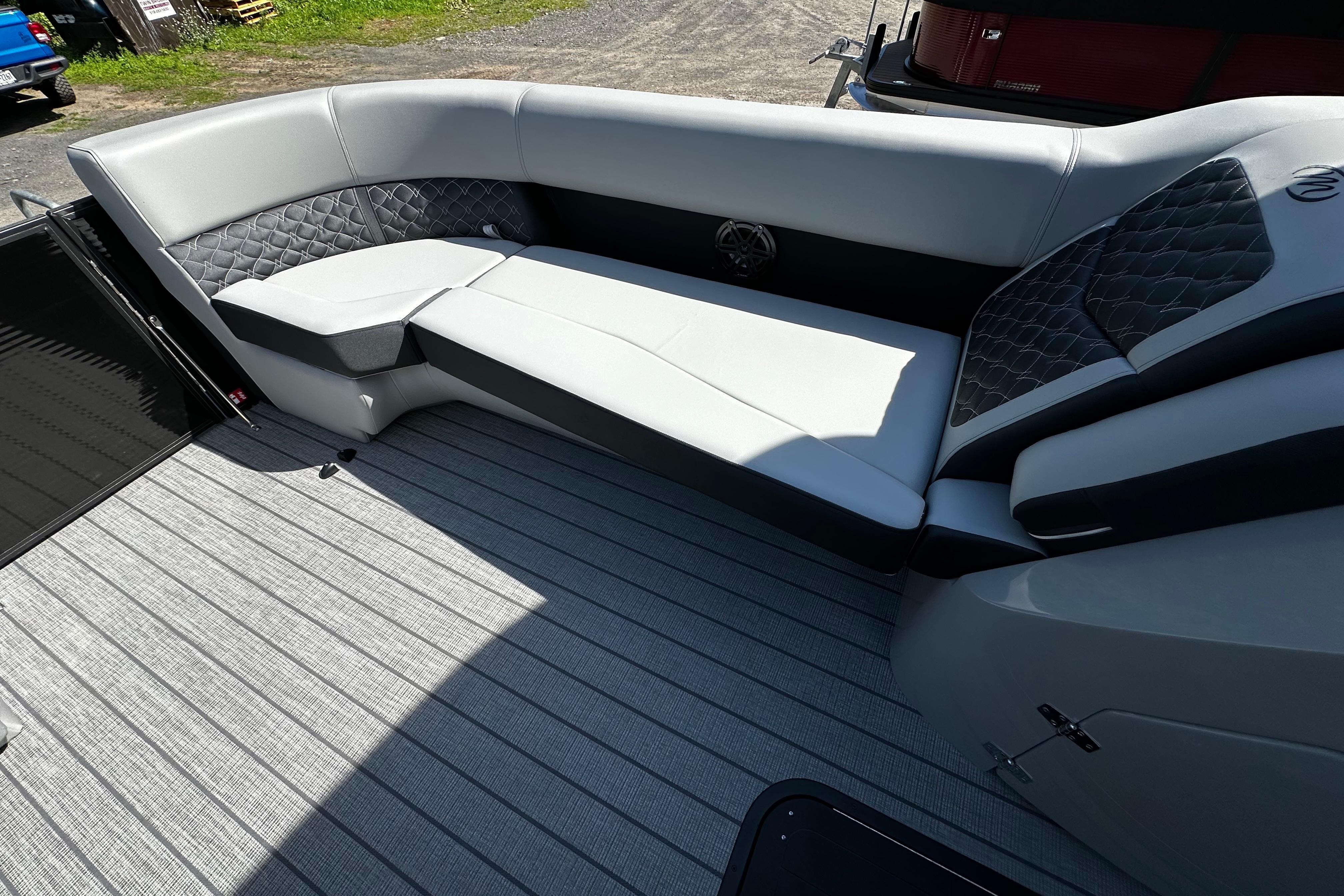 2027 Manitou 25 Encore RF boat interior with sleek seating and modern design.