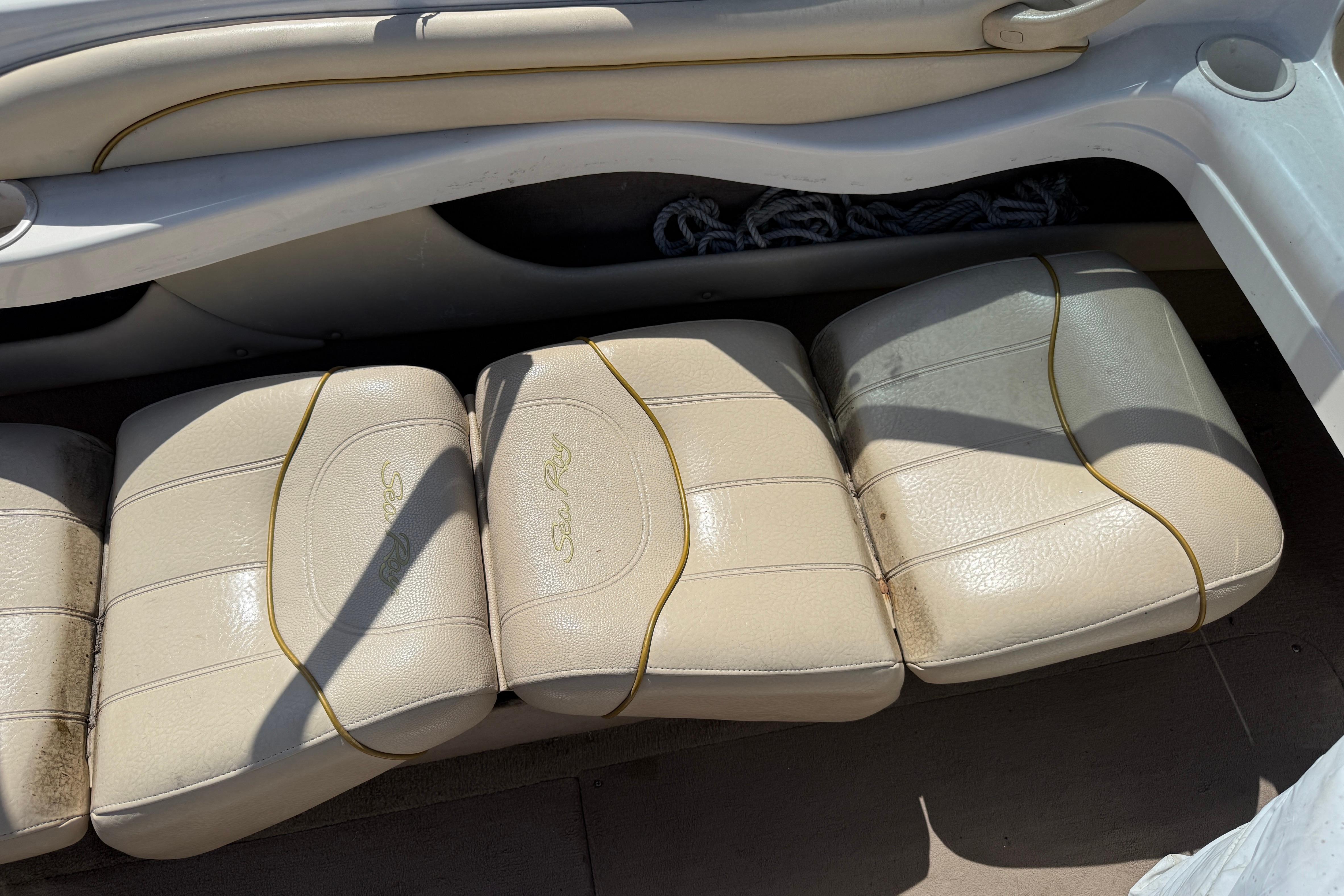 Beige leather seats on a 2001 Sea Ray 180 Bow Rider boat.