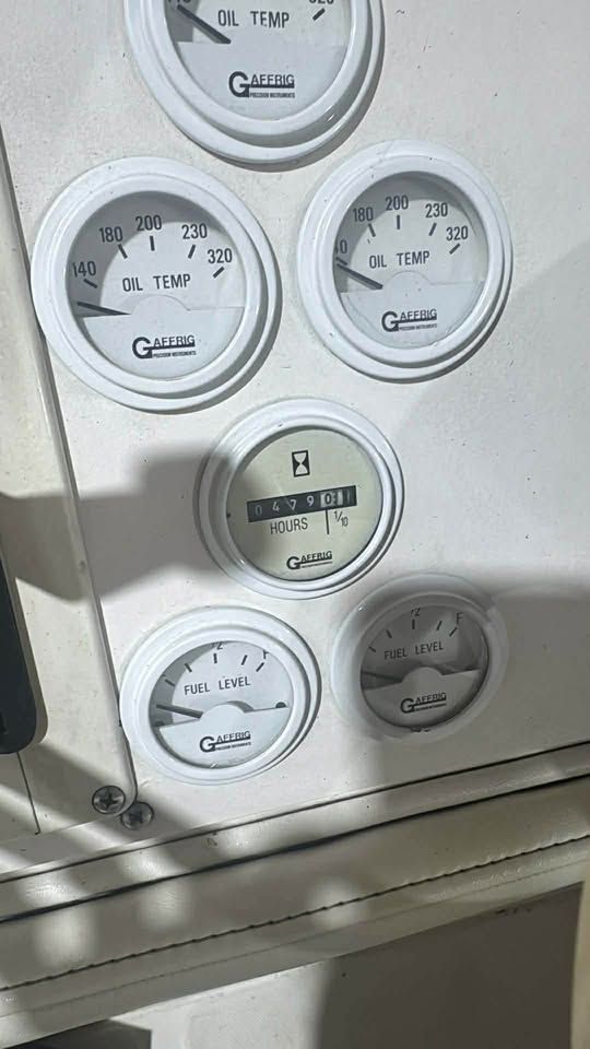 Dashboard of a 1996 Fountain 42Ft boat with gauges.