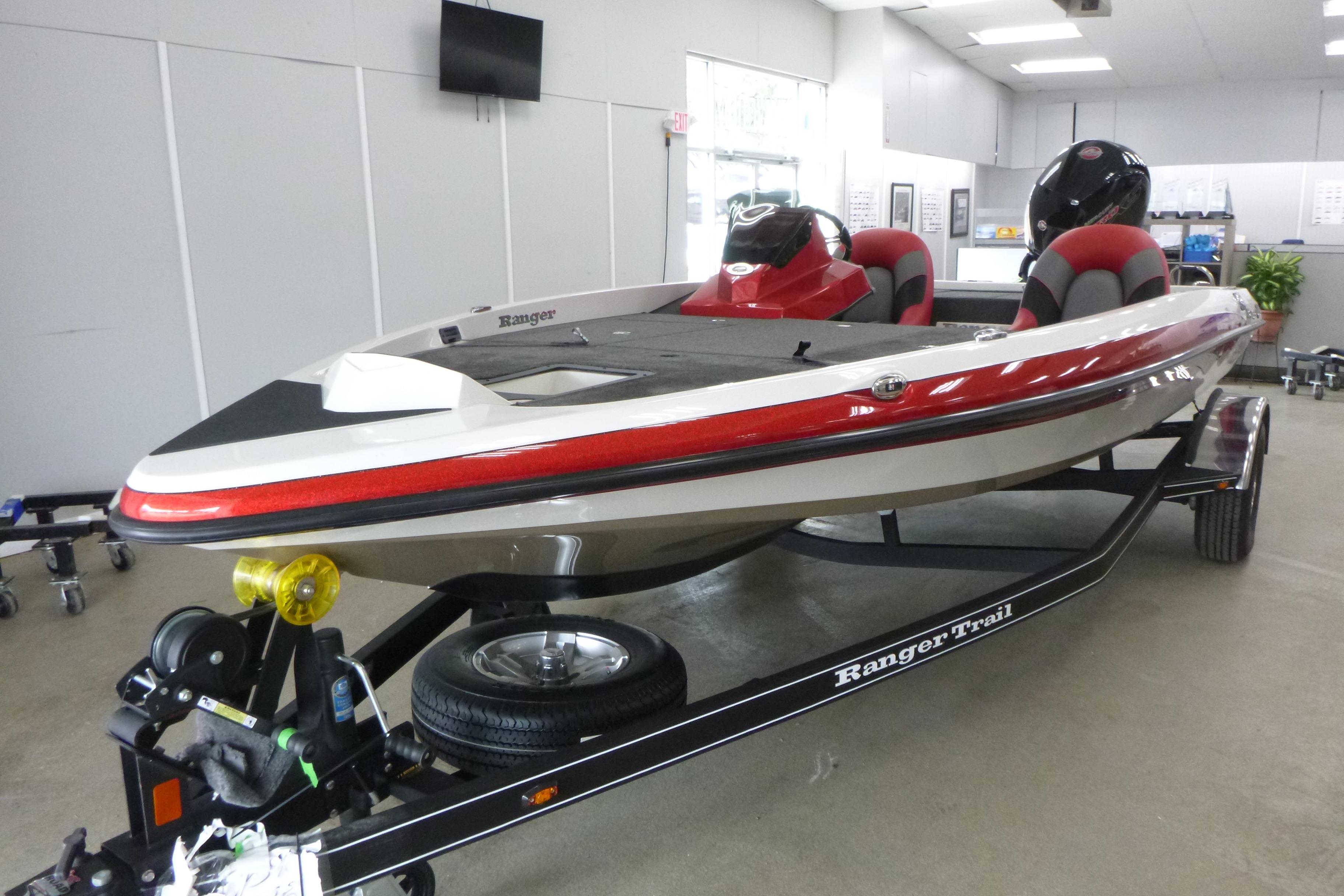 2025 Ranger Z185 boat on trailer in showroom, featuring sleek design and red accents.