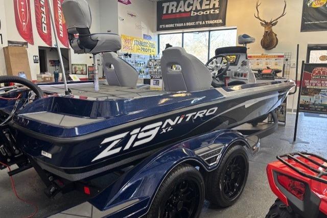 2026 Nitro Z19 XL boat in showroom, featuring sleek design and modern seating.